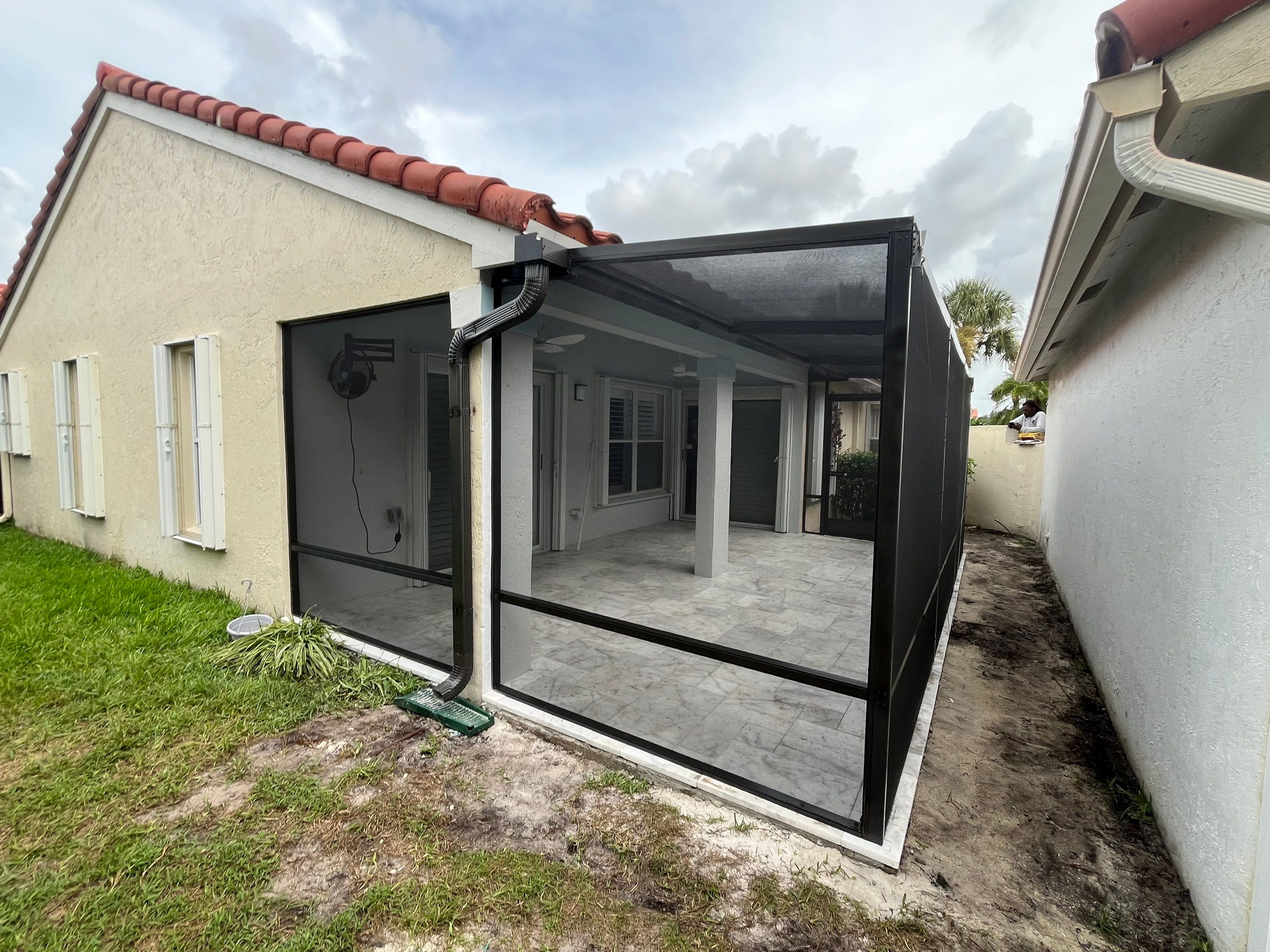 Bronze Aluminum Screen Enclosure and Marble Tile Patio in Boynton Beach by The Screen Depot, Inc
