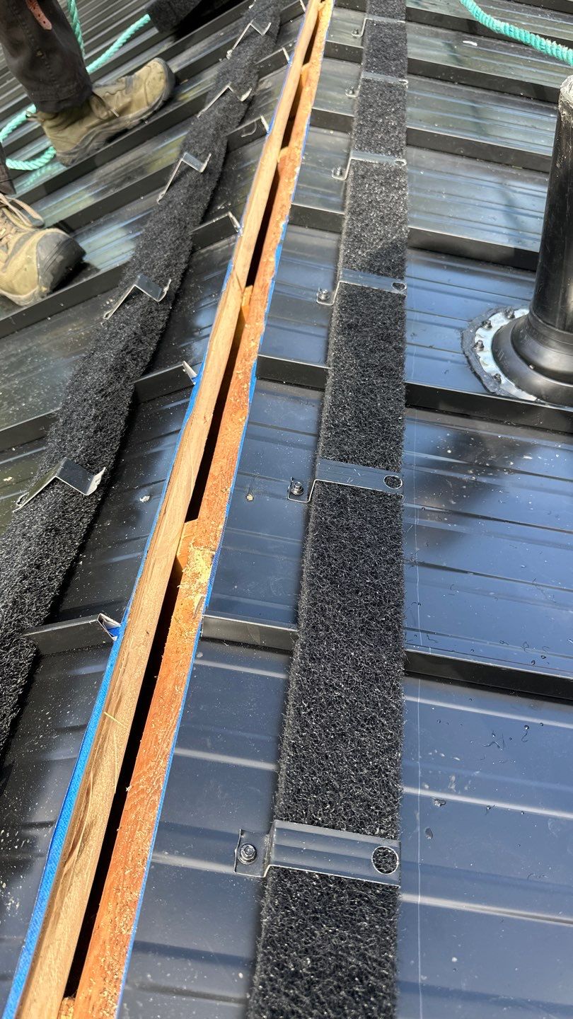 Residential ReRoofing Installation using 12" Prolok metal by Top Notch Roofing Inc