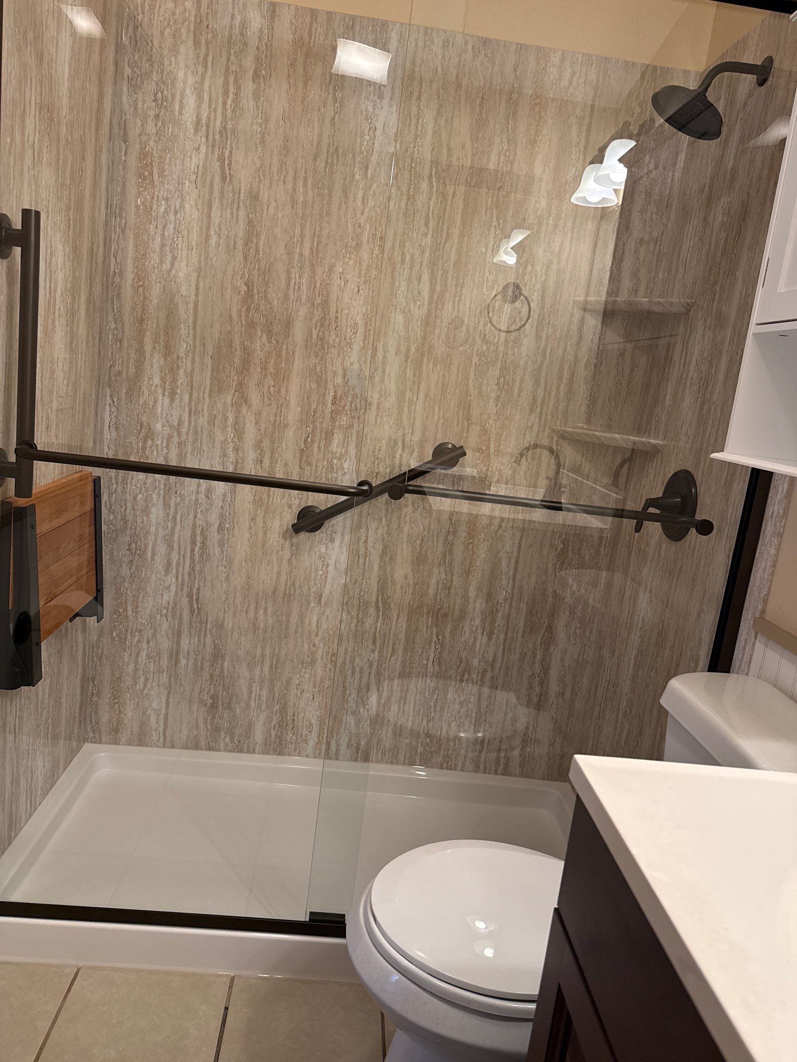 Prudenville Bath Remodel with Stone-Look Shower by Rainbow Seamless Systems