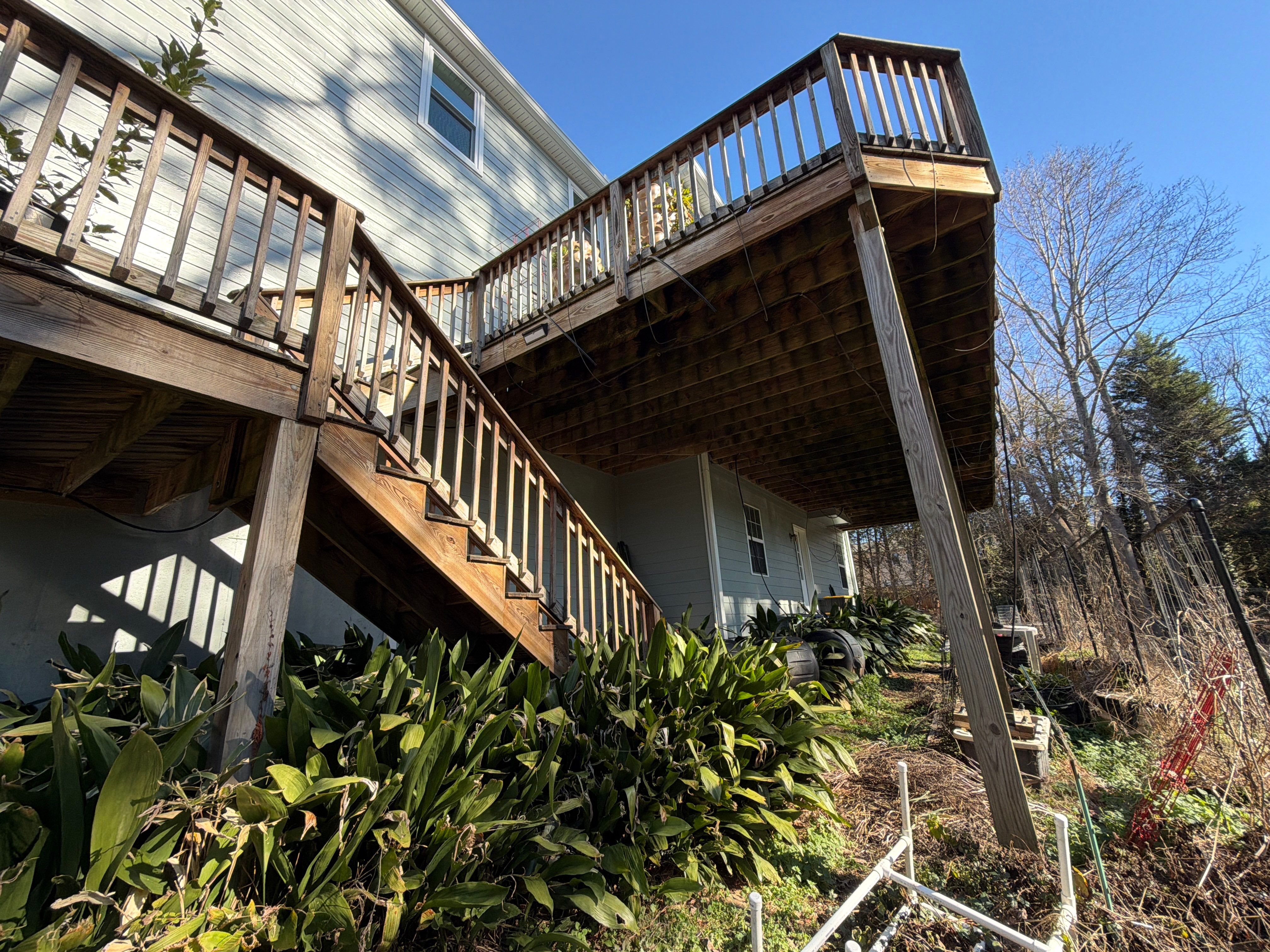 Covered Porch and Deck Build using Deckorators Venture Series Decking and Trex Select Aluminum Railing by Nelson Exteriors