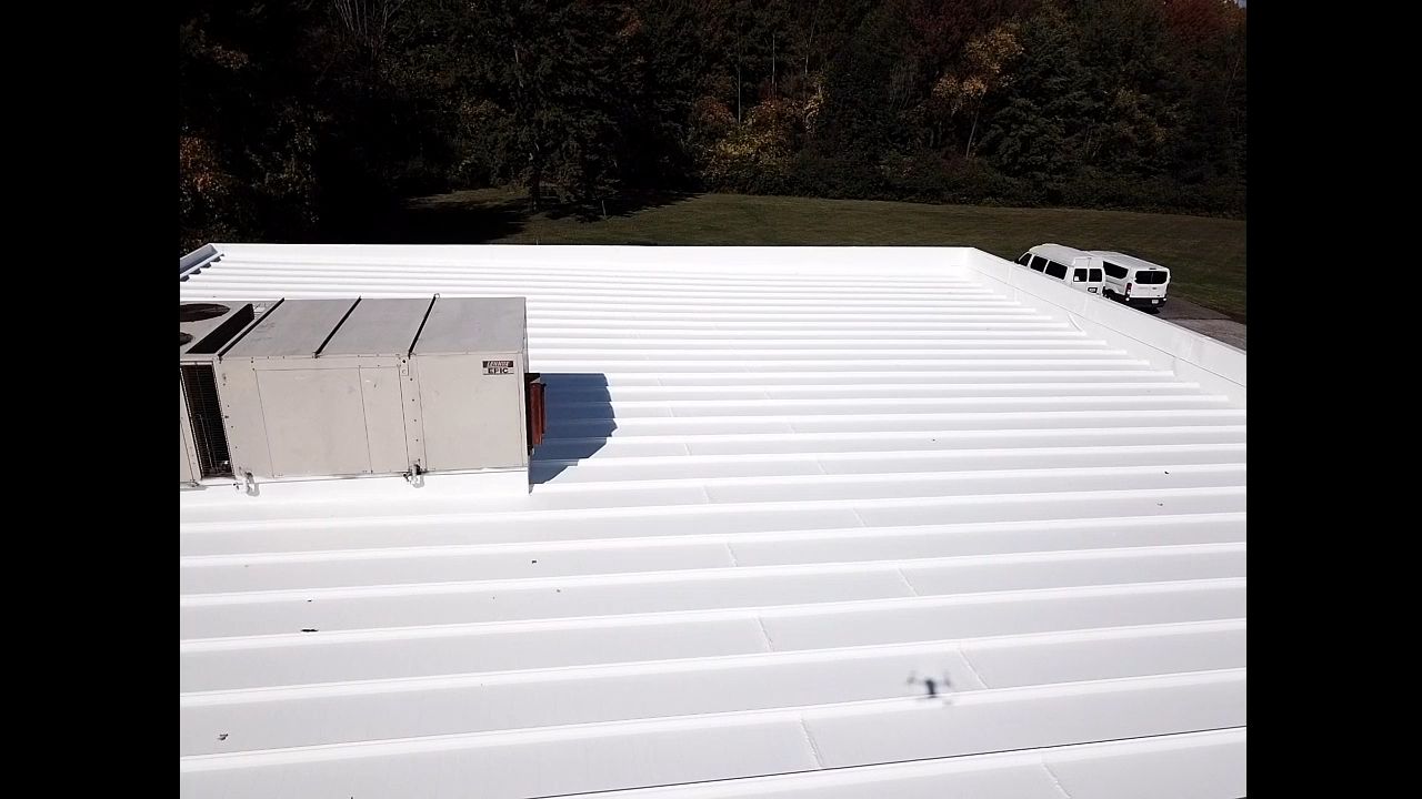 Commercial Metal Roof Coating by Gold Star Roofing LLC