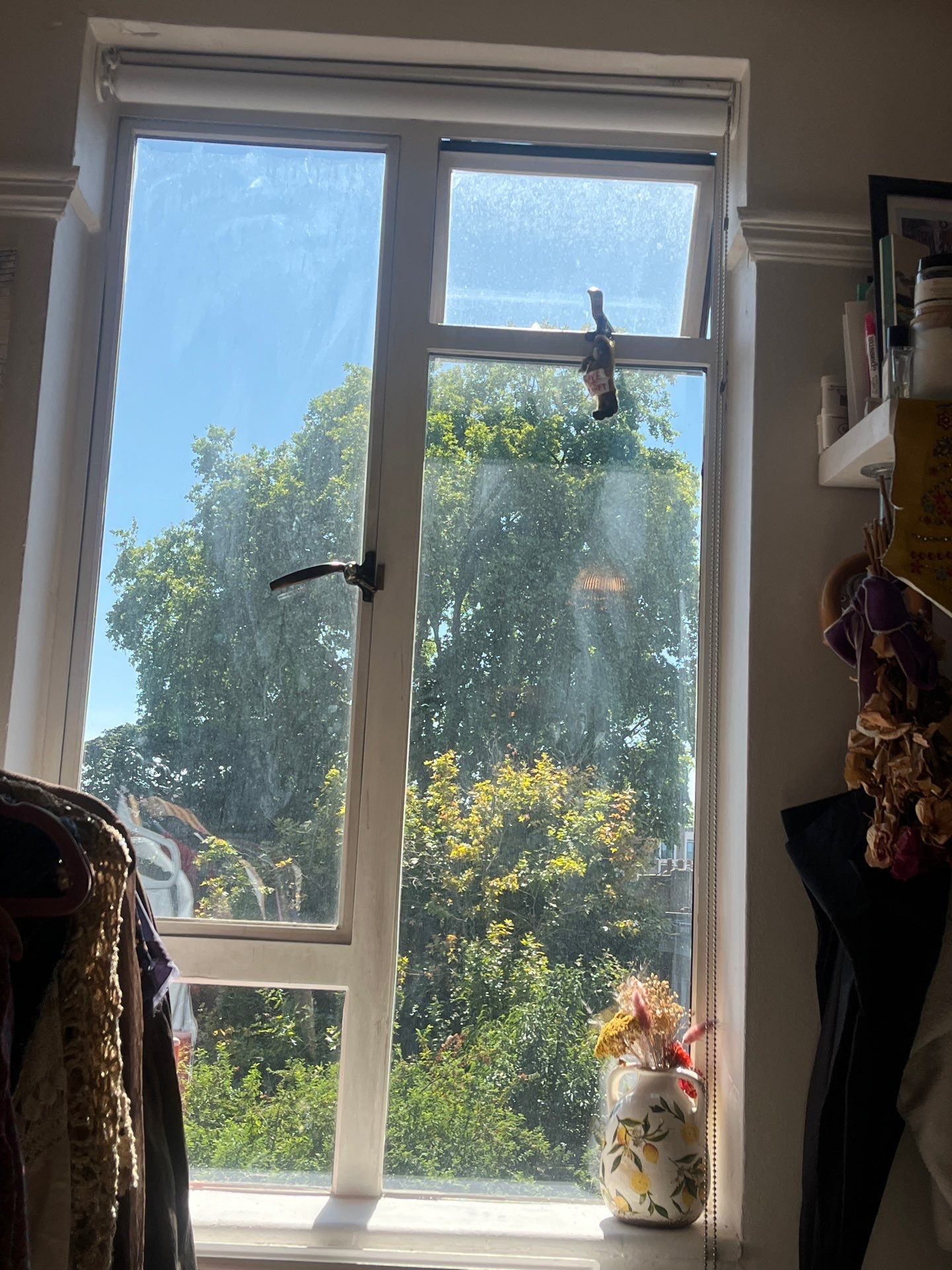 White Casement Window Installation with Black Metal Hardware in England by CompanyCam Sales Demo