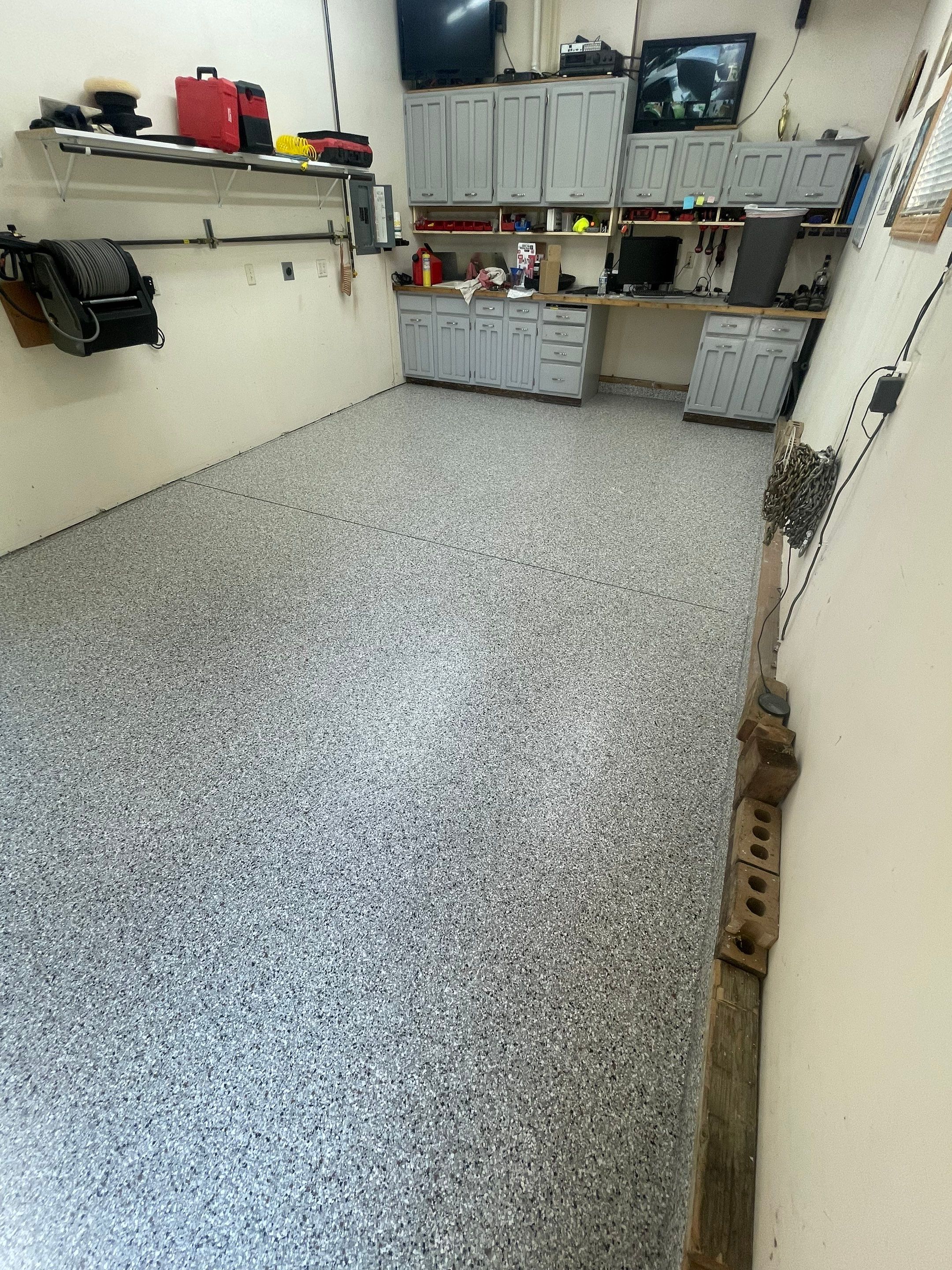 Multi-Stall Garage Floor Coating Installation in Sioux Falls by Select Painting, Coatings & Garage Cabinets