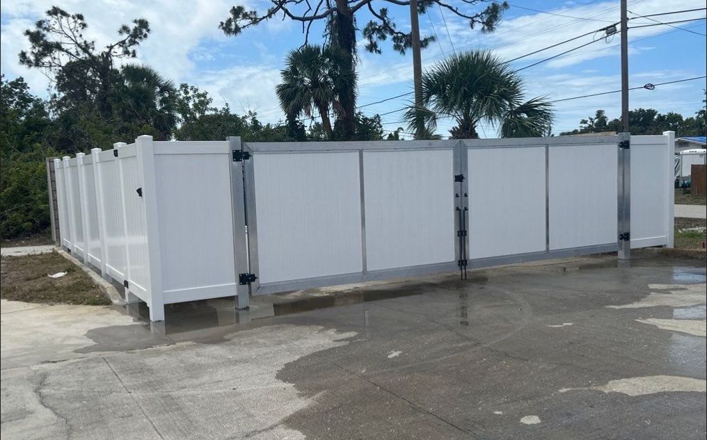 Commercial Chainlink and Vinyl Fence With Aluminum Framed Gates On Dumpster Enclosure by Asap fence and gates, LLC