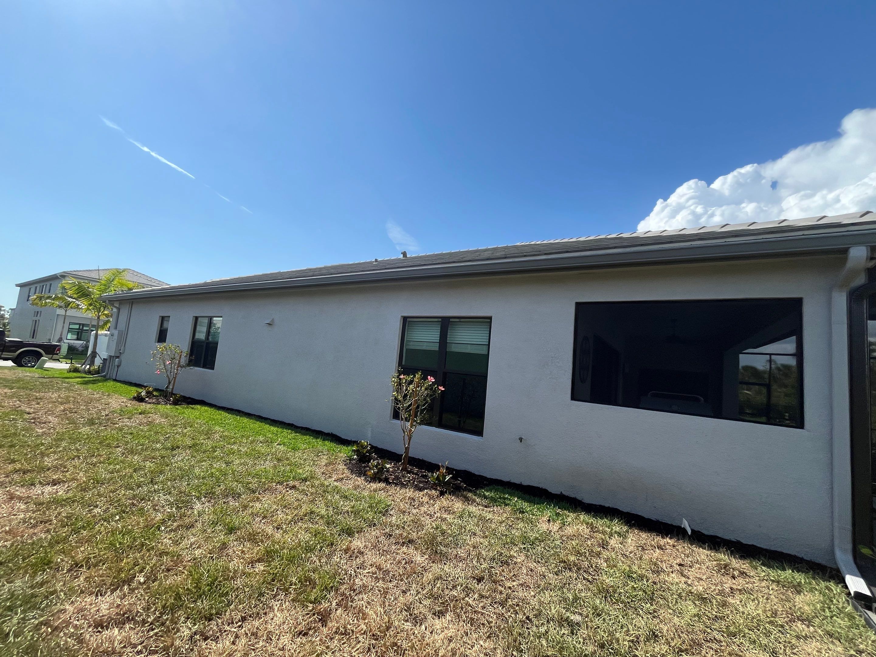 Grey Seamless Gutter Installation in Estero FL by Gutter Professors