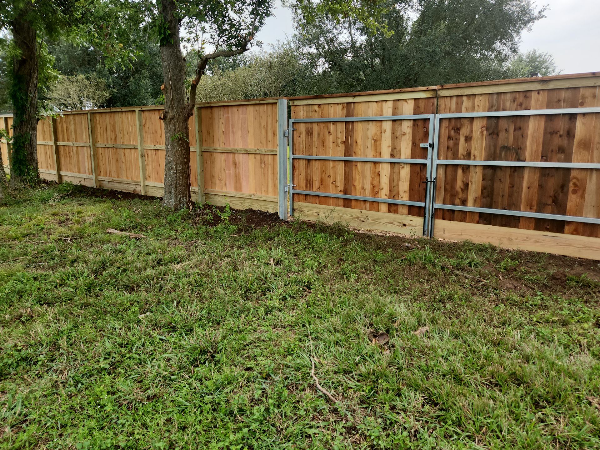 Wood Fence Installation for HOA by Tim's Fences