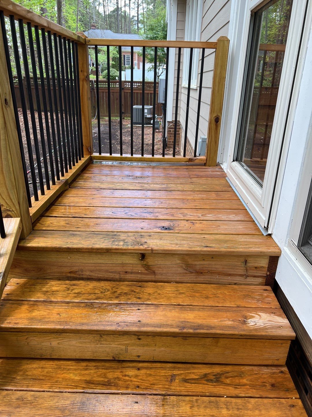 Deck and Stamped Concrete Patio by DuraSeal
