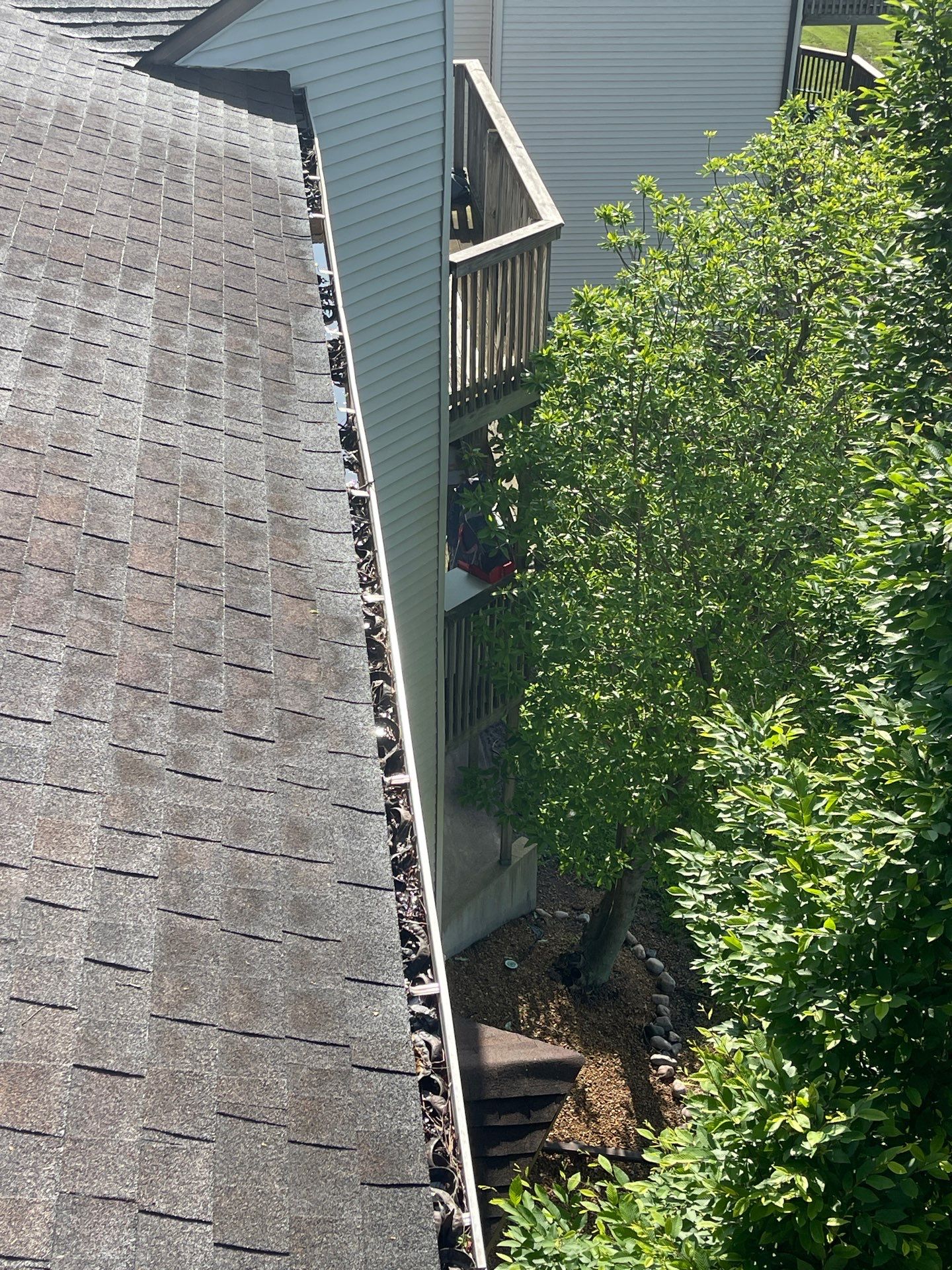 Commercial gutter cleaning Champaign & Urbana before photo with filled gutters