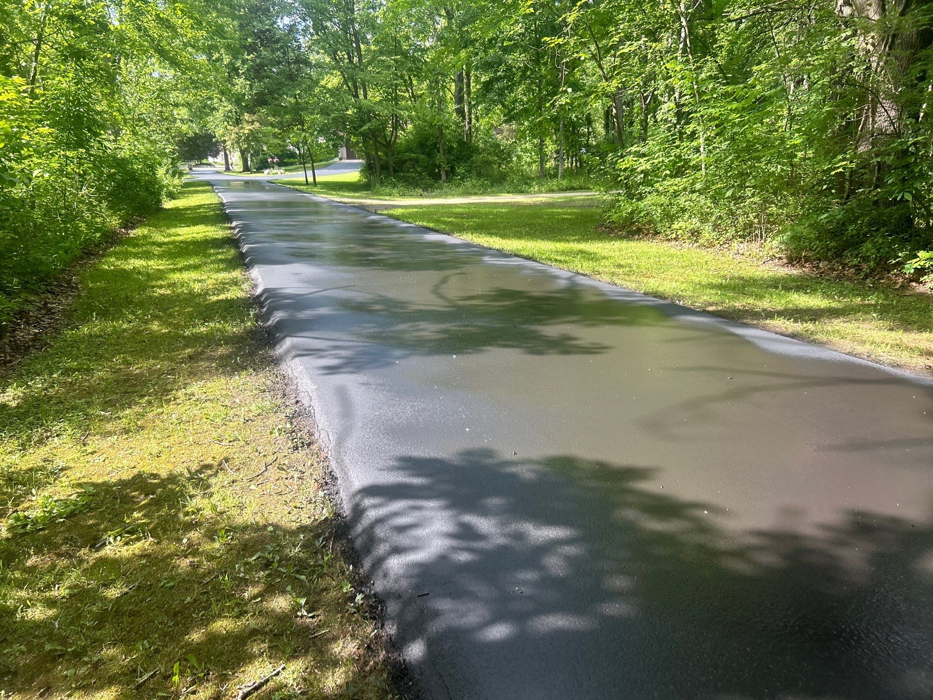 High end residential driveway by Quality Asphalt & Maintenance LLC
