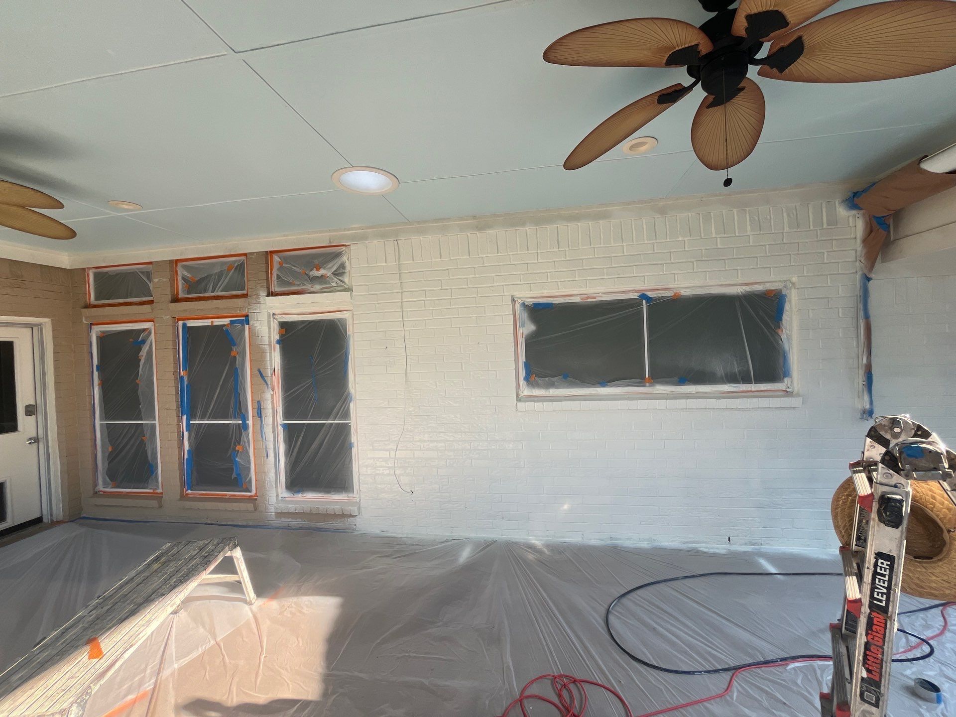 Exterior Painting in Tyler, TX | Brick House with White & Blue Finish by Quality Coats Painting