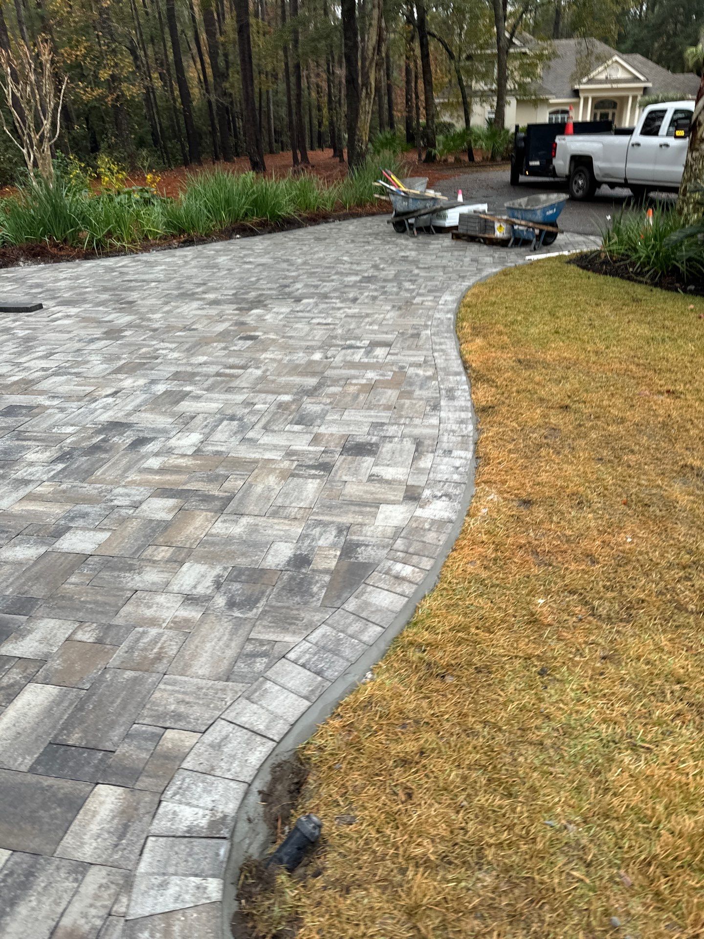Custom Paver Driveway and Textured Pool Deck Installation in Hilton Head Island by Lowcountry Scapes, LLC