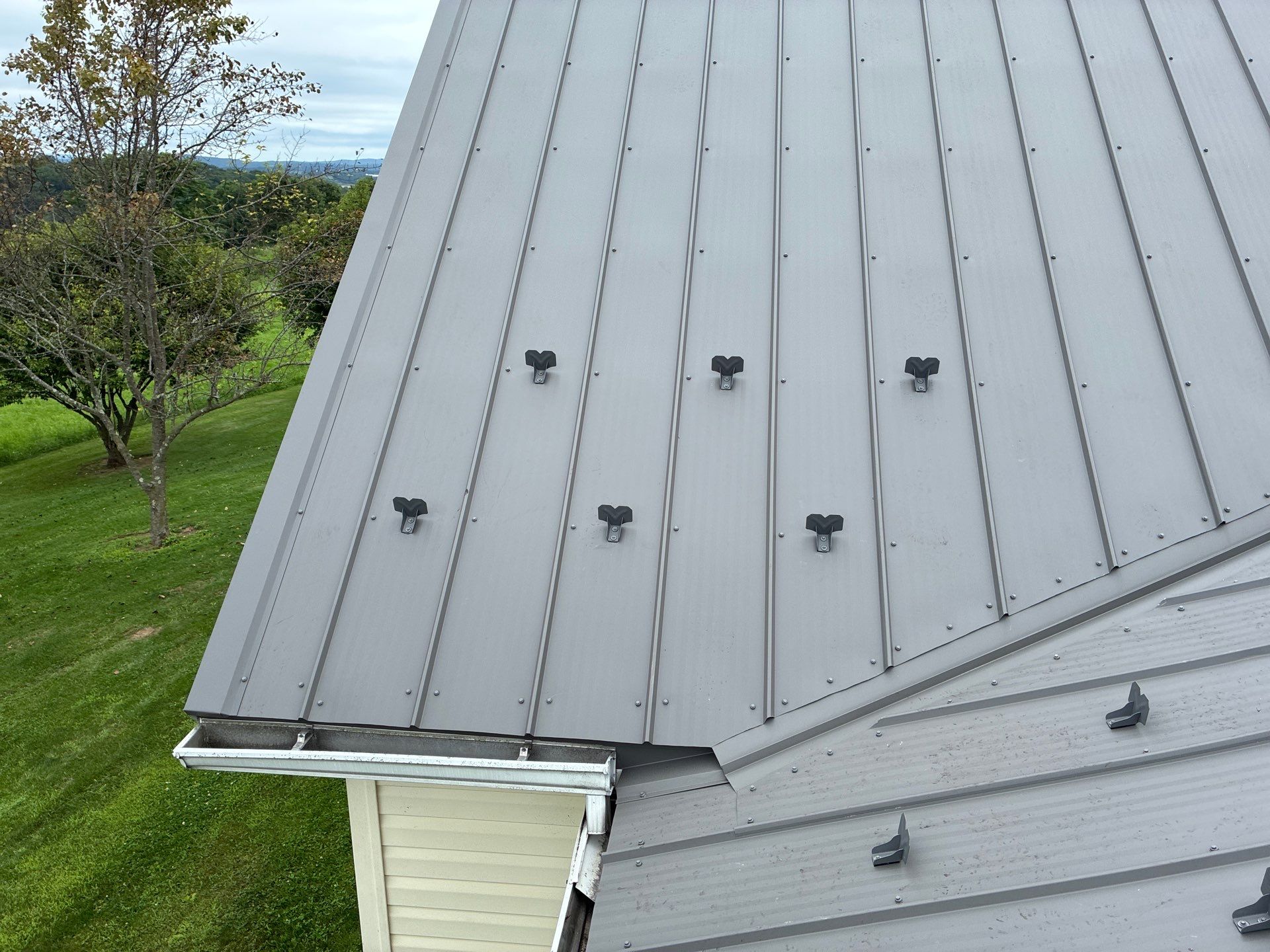Newport Metal Roof Replacement with New Skylights by Esh Builders