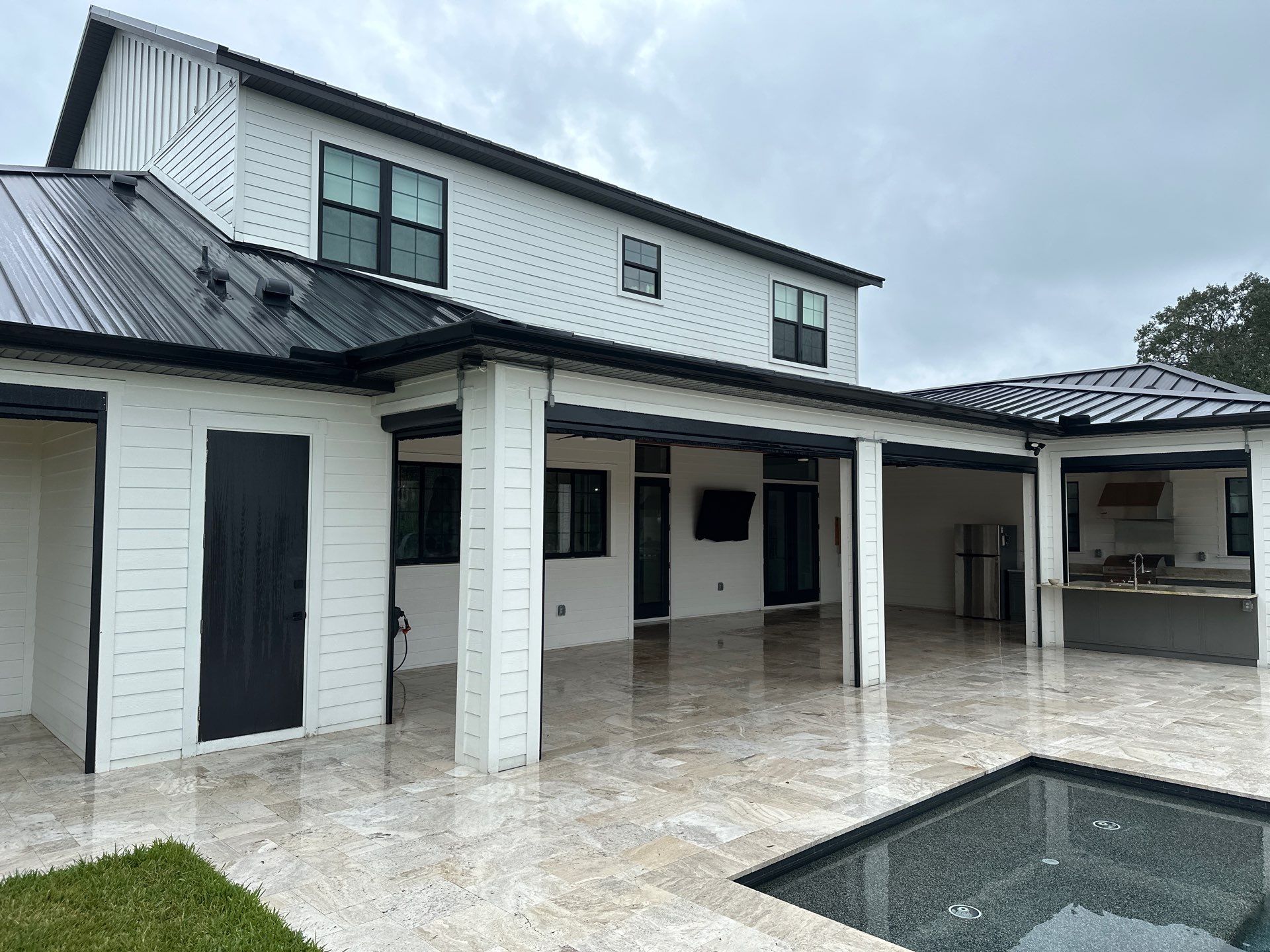 Complete Two-Story House Wash and Driveway Cleaning in Winding River Community, Bradenton, FL by Sunshine AquaWash
