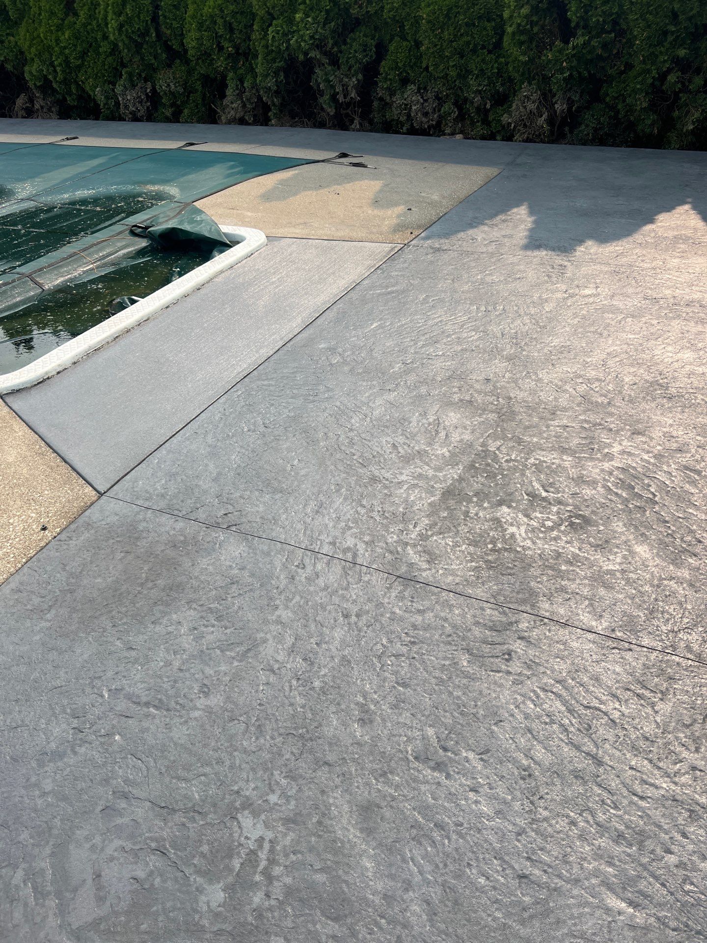 Bluestone stamped concrete patio  by NG Masonry & Construction LLC