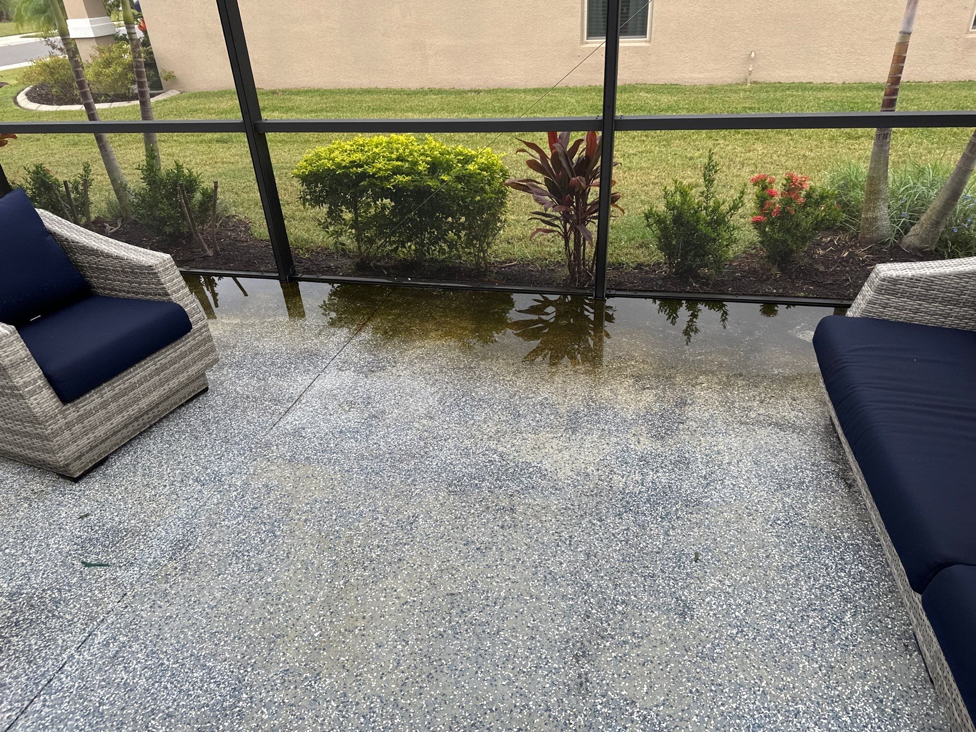 Lanai & Patio Cleaning with Epoxy-Coated Concrete Floor in Trevesta Community, Palmetto, FL | Sunshine AquaWash by Sunshine AquaWash