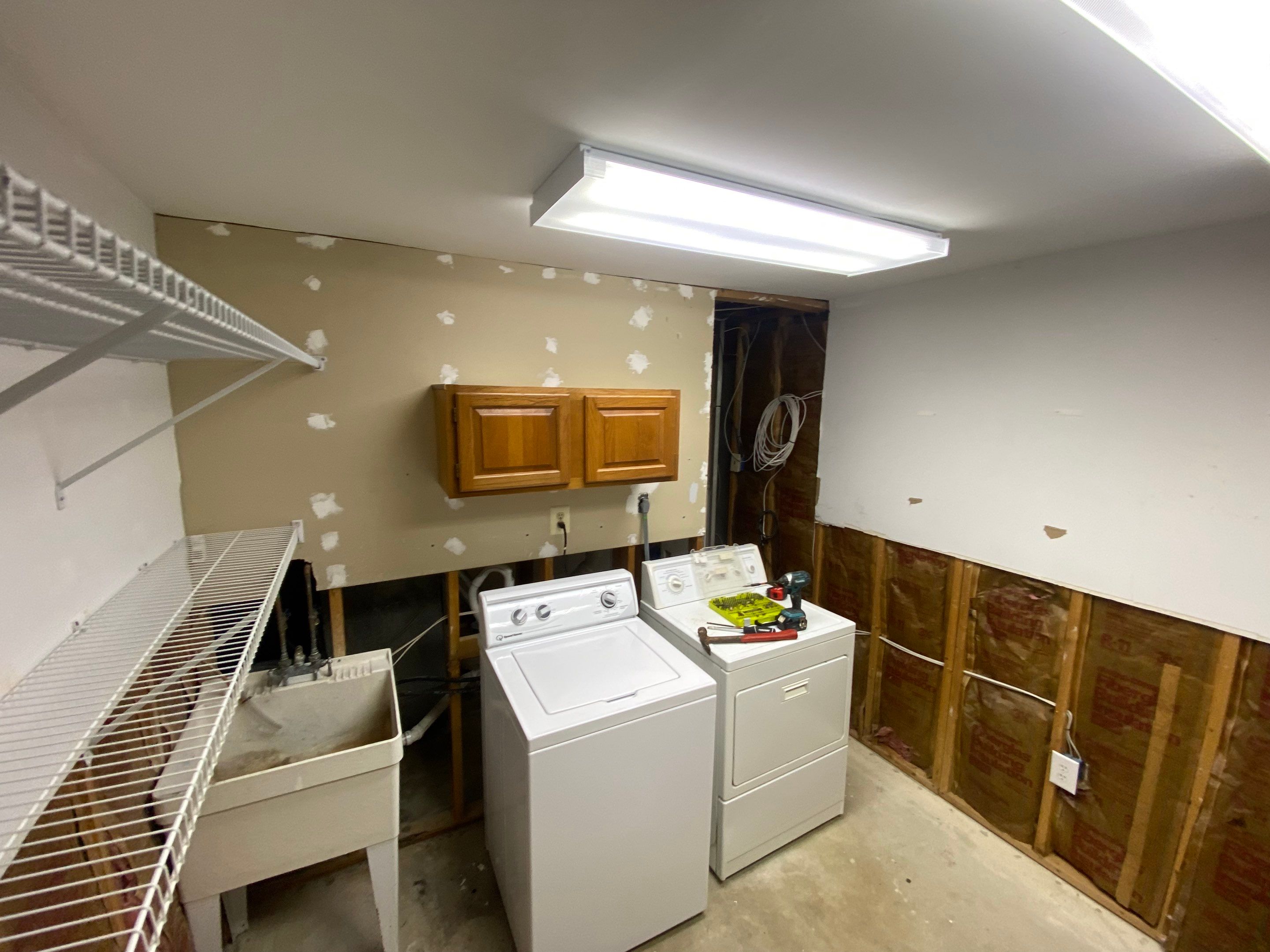 Laundry Room Redmodel using Lifeproof Luxury Vinyl Plank Flooring by The Smet Companies, LLC