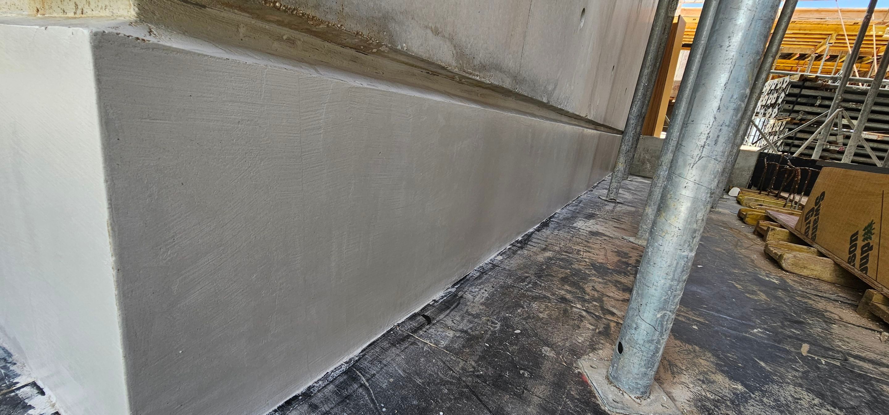 Microtopping over Exterior Walls by Seamless Surfaces