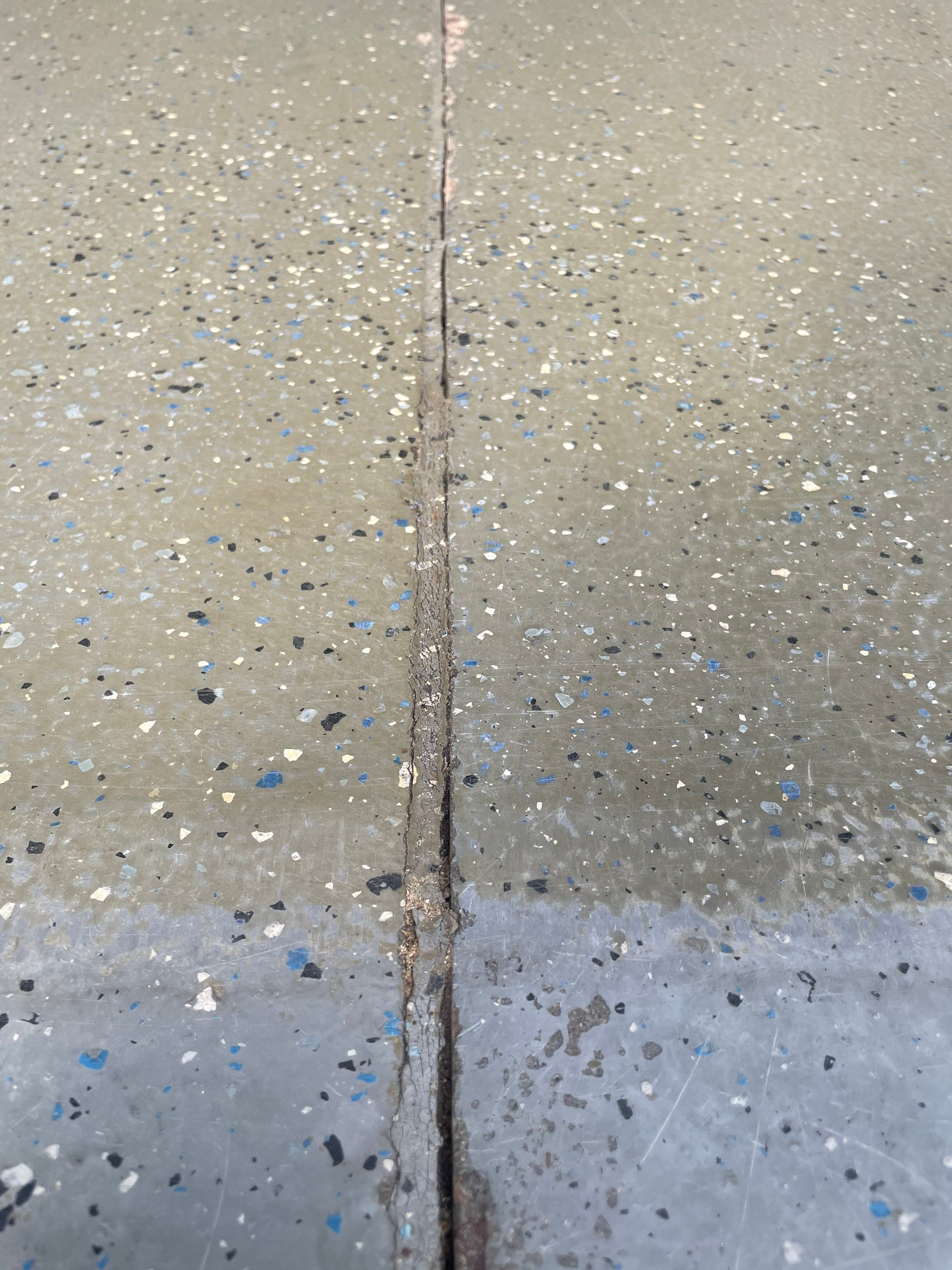 Multi-Car Garage Concrete Coating with Coyote Flake Finish in Sioux Falls by Select Painting, Coatings & Garage Cabinets