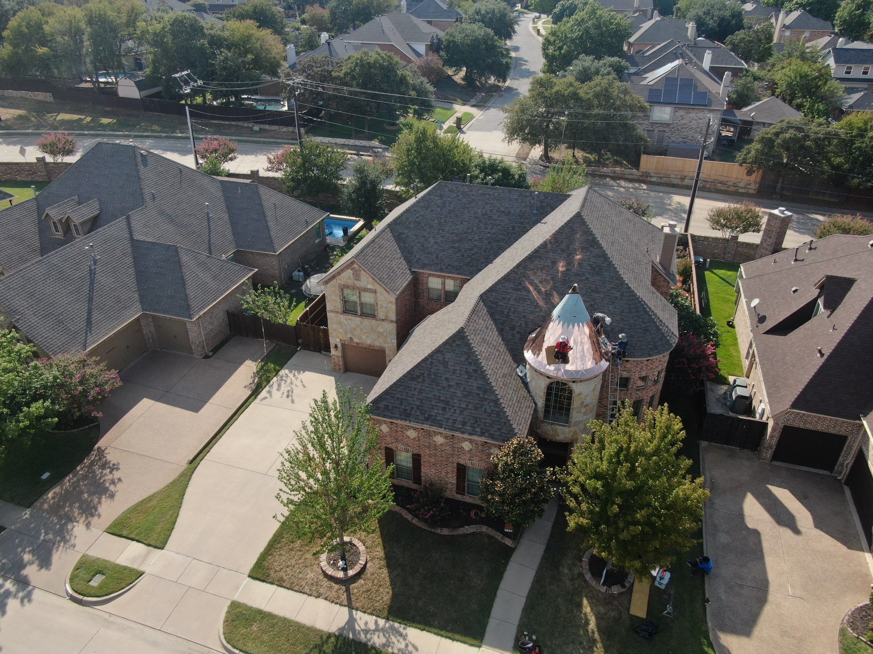 Installing Custom copper turret and Malarkey Vista Class 4 shingles Hail Damage Upgrade by Becker Roofing and Exteriors