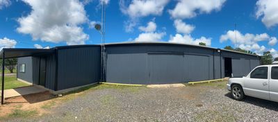 Exterior Painting in Kilgore, TX | Metal Building Transformation from White to Grey