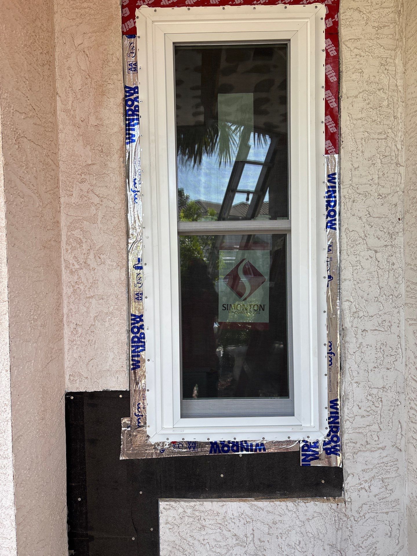 Installing Windows on a Submarine  by Bayfront Roofing and Construction