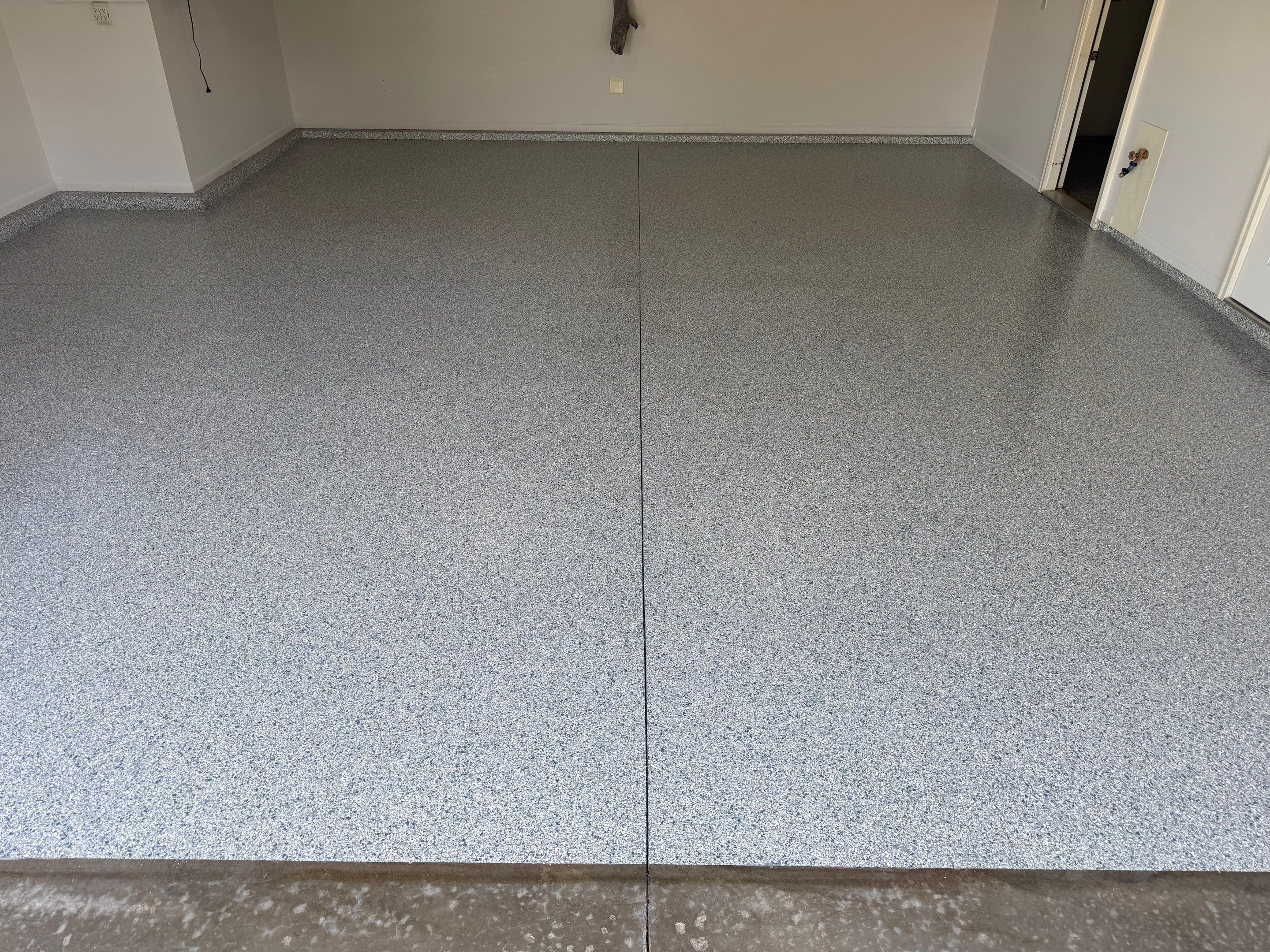 Decorative Chip Epoxy Floor Coating Installation in Sioux Falls by Select Painting, Coatings & Garage Cabinets