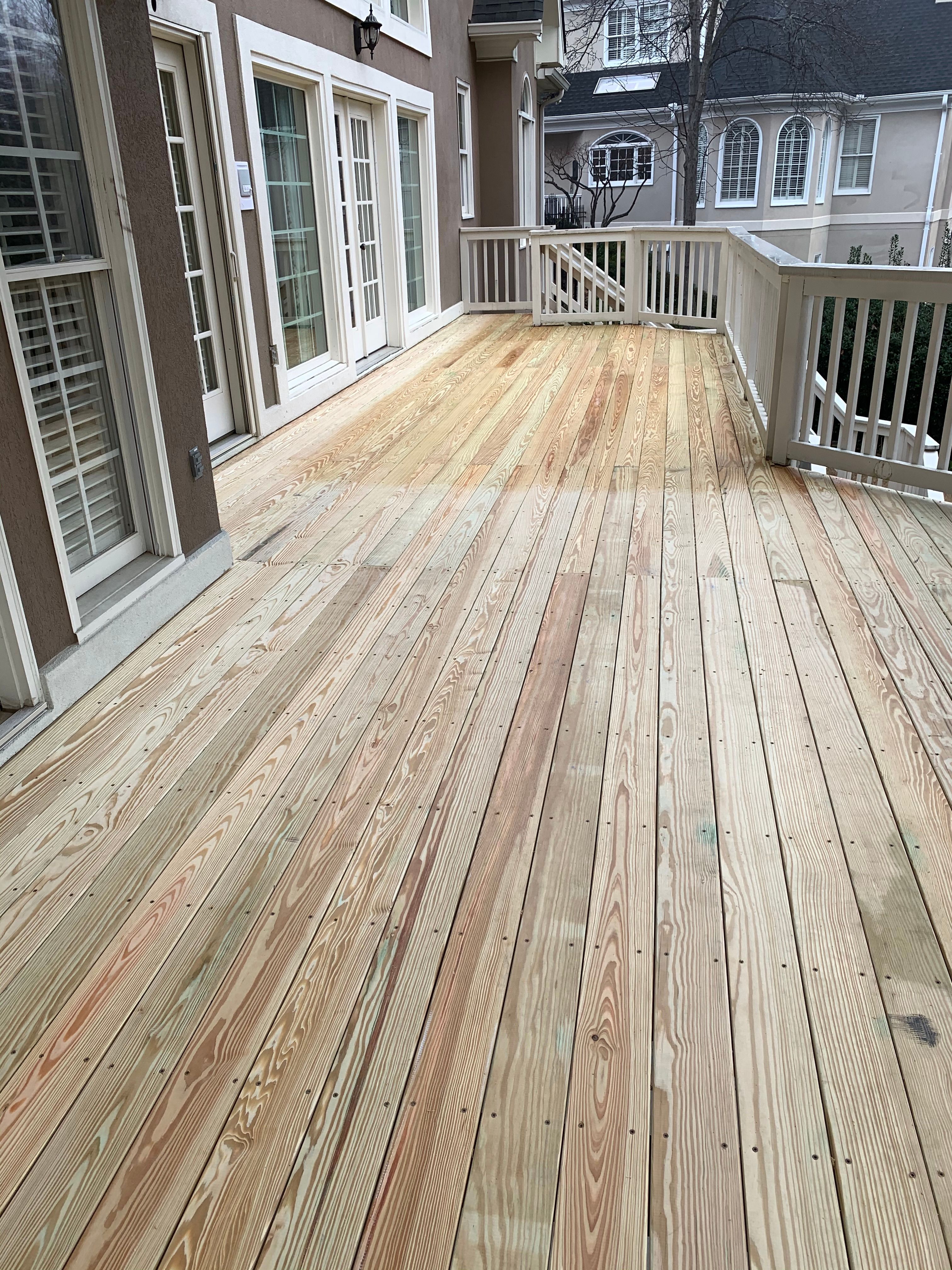 Pressure-Treated Wood Deck Renovation and Railing Refresh in Duluth by Swift Home Renovations 