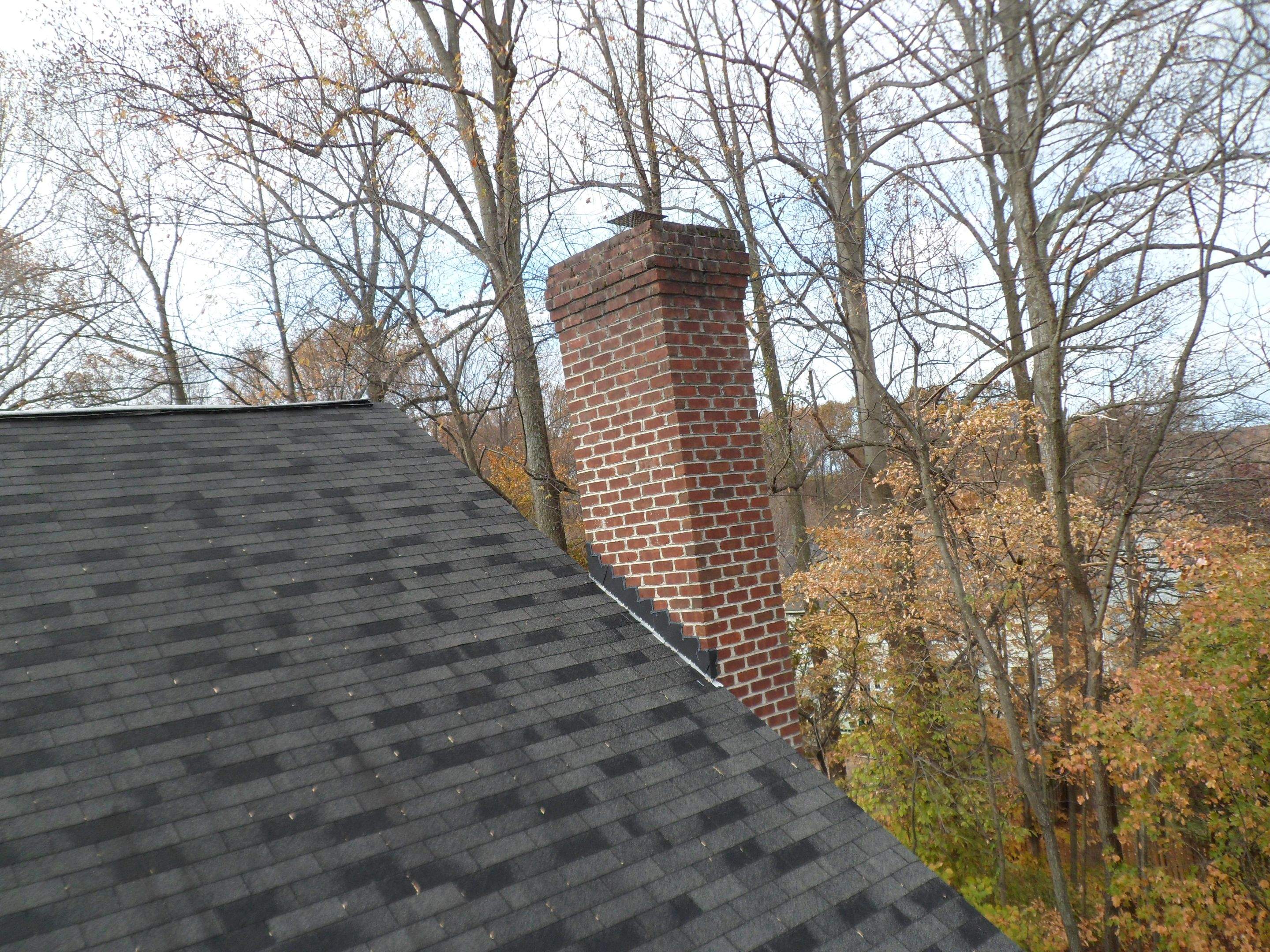 Residential Roofing Installation using Charcoal Black by Alpha Design Services
