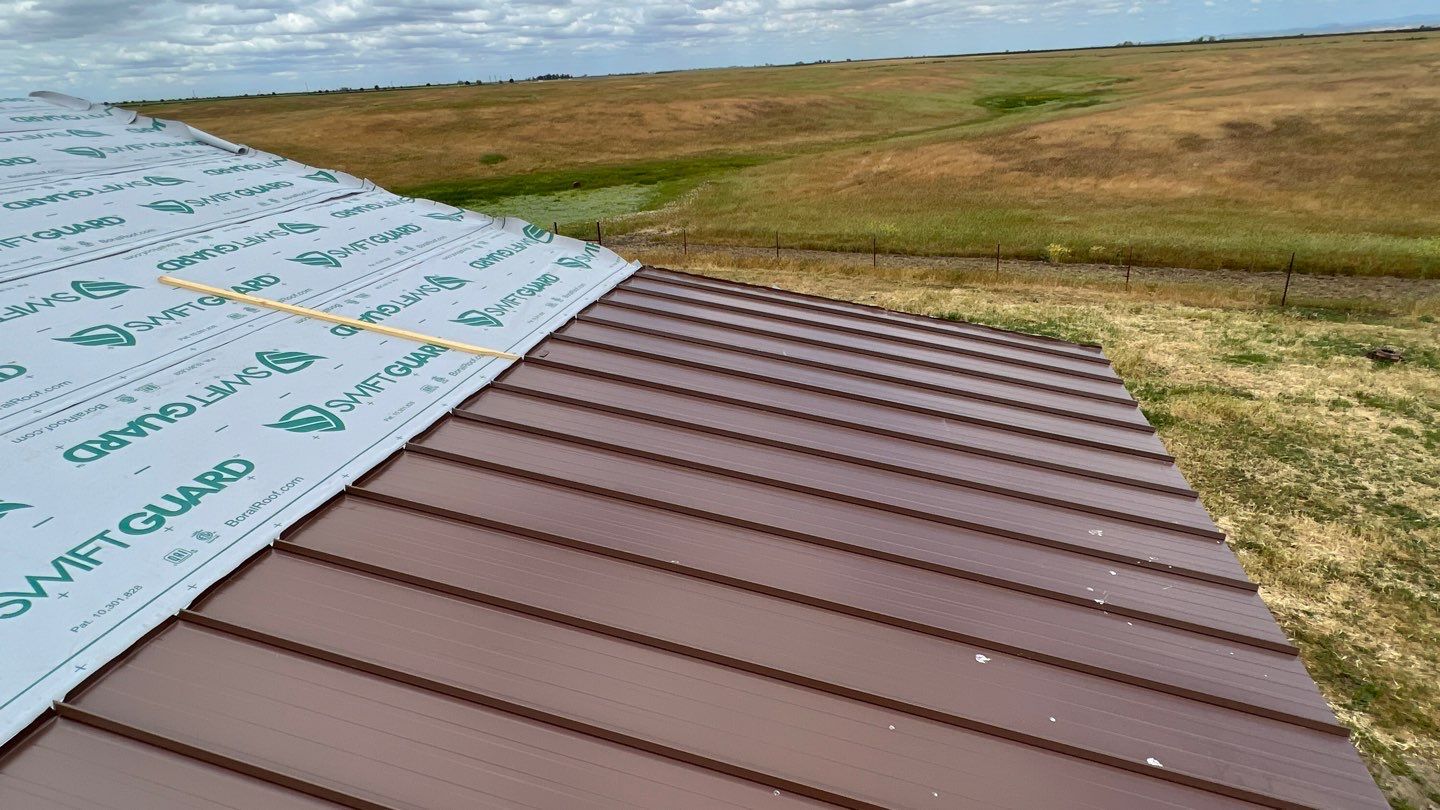 Metal roofing installation using Standing seam metal roofing system by Straight Edge Roofing Inc