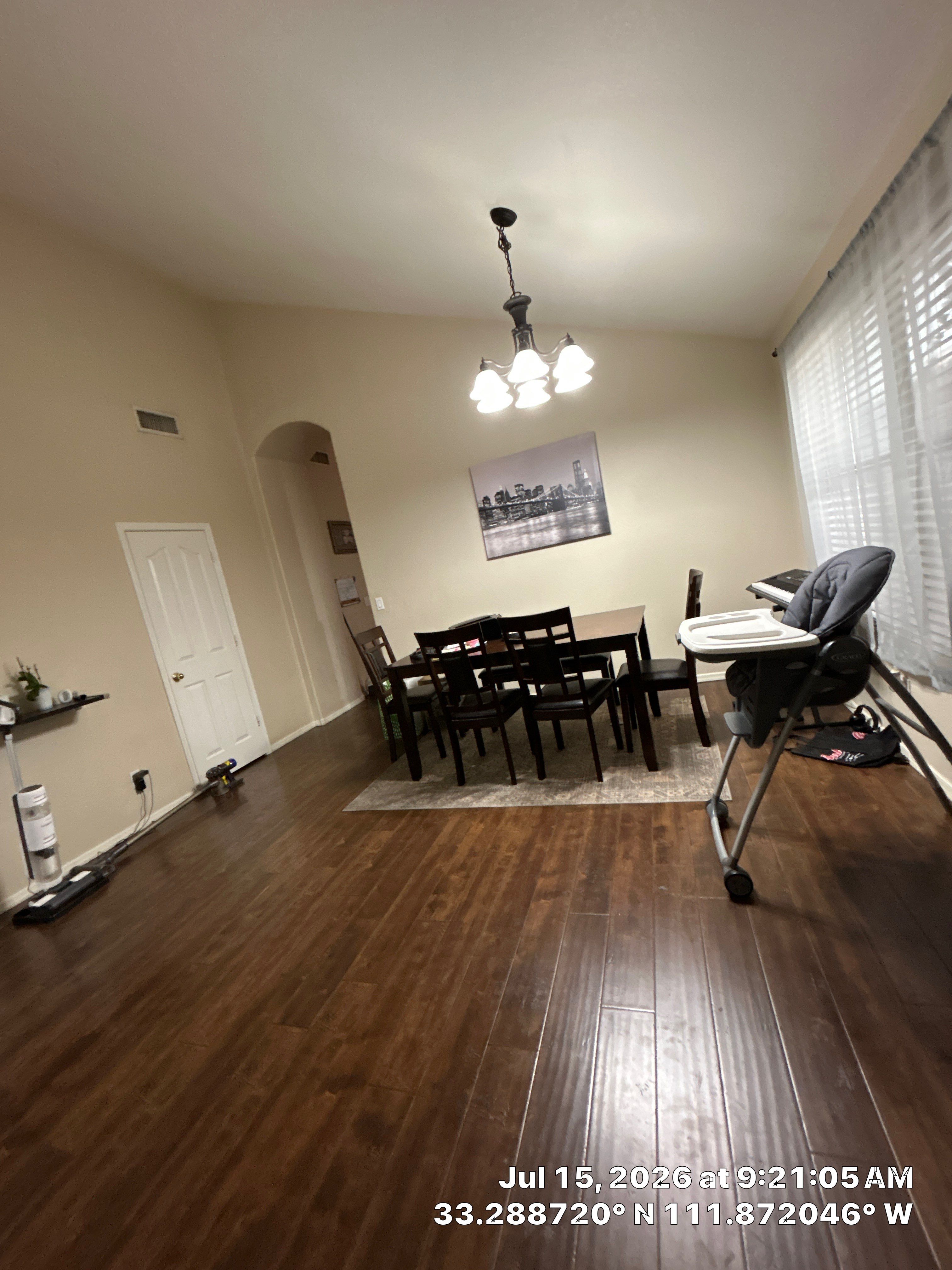 Dark Wood Laminate Flooring Installation for Chandler Dining Room by CompanyCam Sales Demo