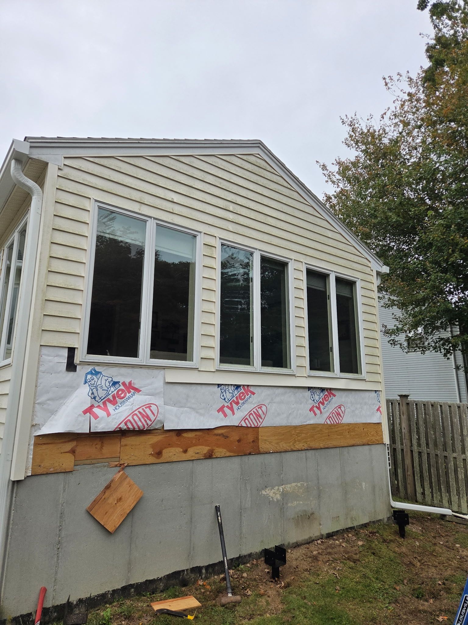 New Deck With Lattice enclosed bottom, Trex Lineage Carmel, Transcend cocktail rail.  by DiGiorgi Roofing and Siding Inc