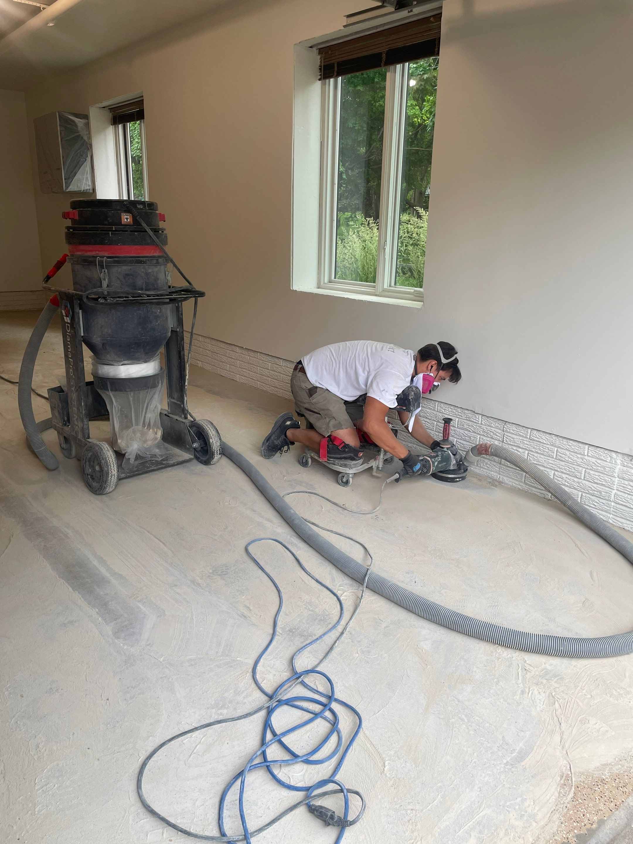 Gray Speckled Epoxy Garage Floor Coating in Sioux Falls by Select Painting, Coatings & Garage Cabinets