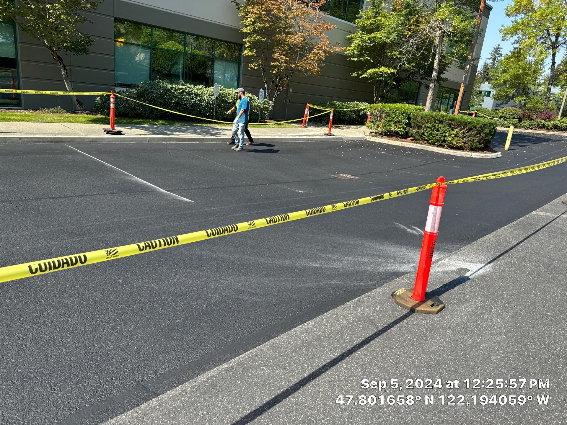 Kidder Matthews | Parking Lot Sealcoating & Striping with Concrete Curb & Patch Repairs  by Jireh Asphalt & Concrete Inc 