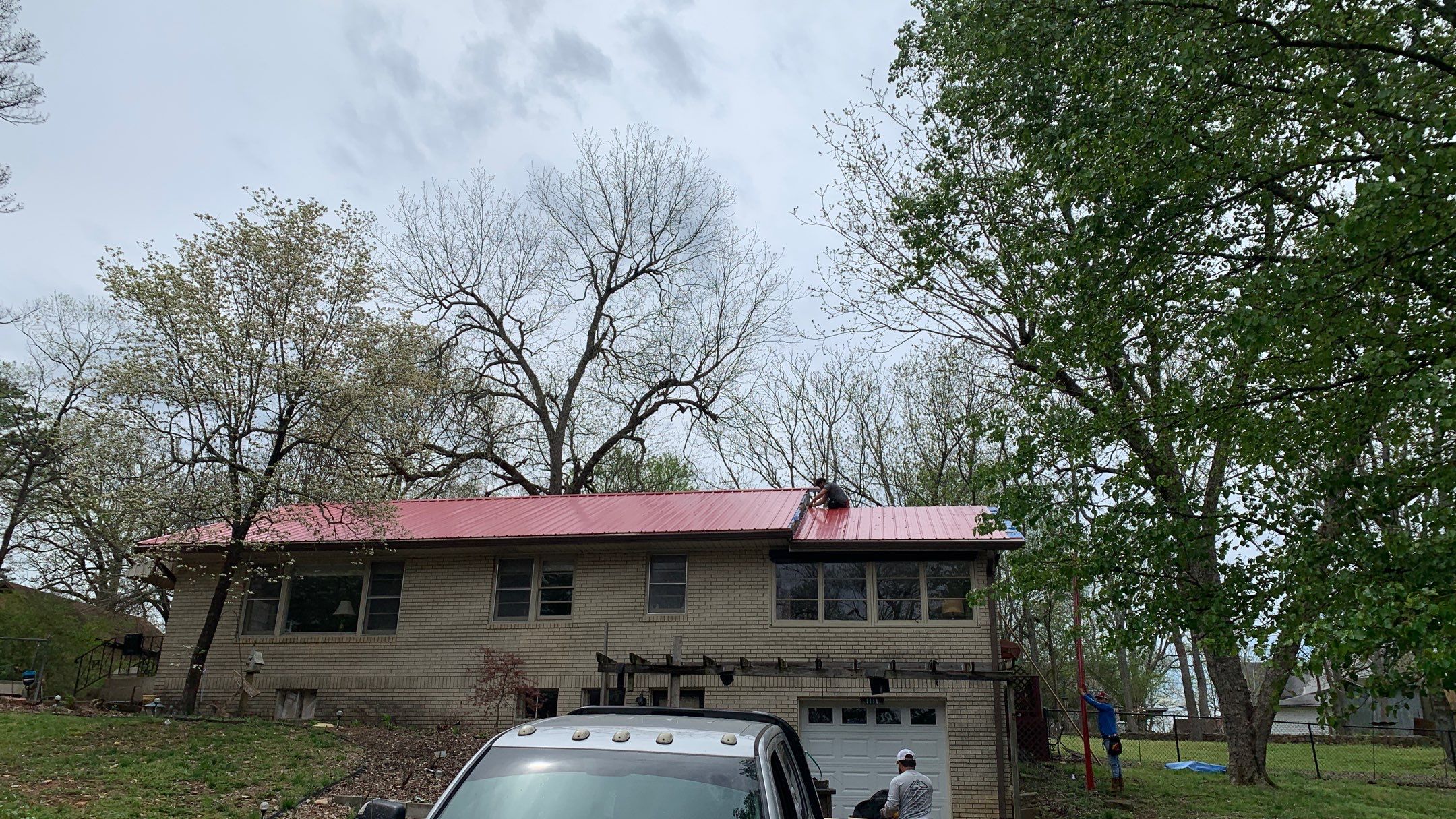 Residential Roofing Installation using 26 Gauge Colored Panels by Hostetler Roofing