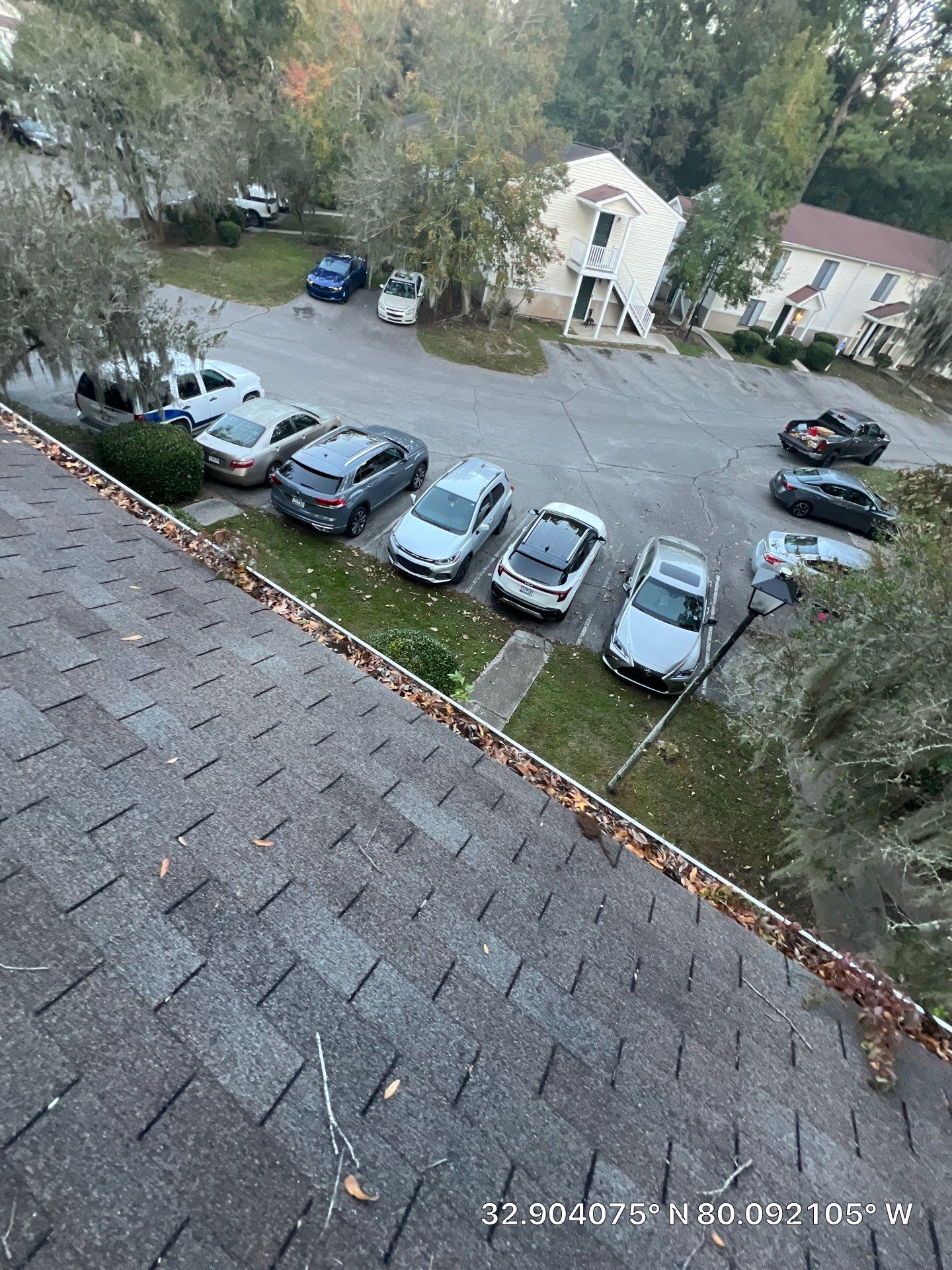 HOA gutter cleaning in Summerville & Goose Creek beforephoto showing full gutters