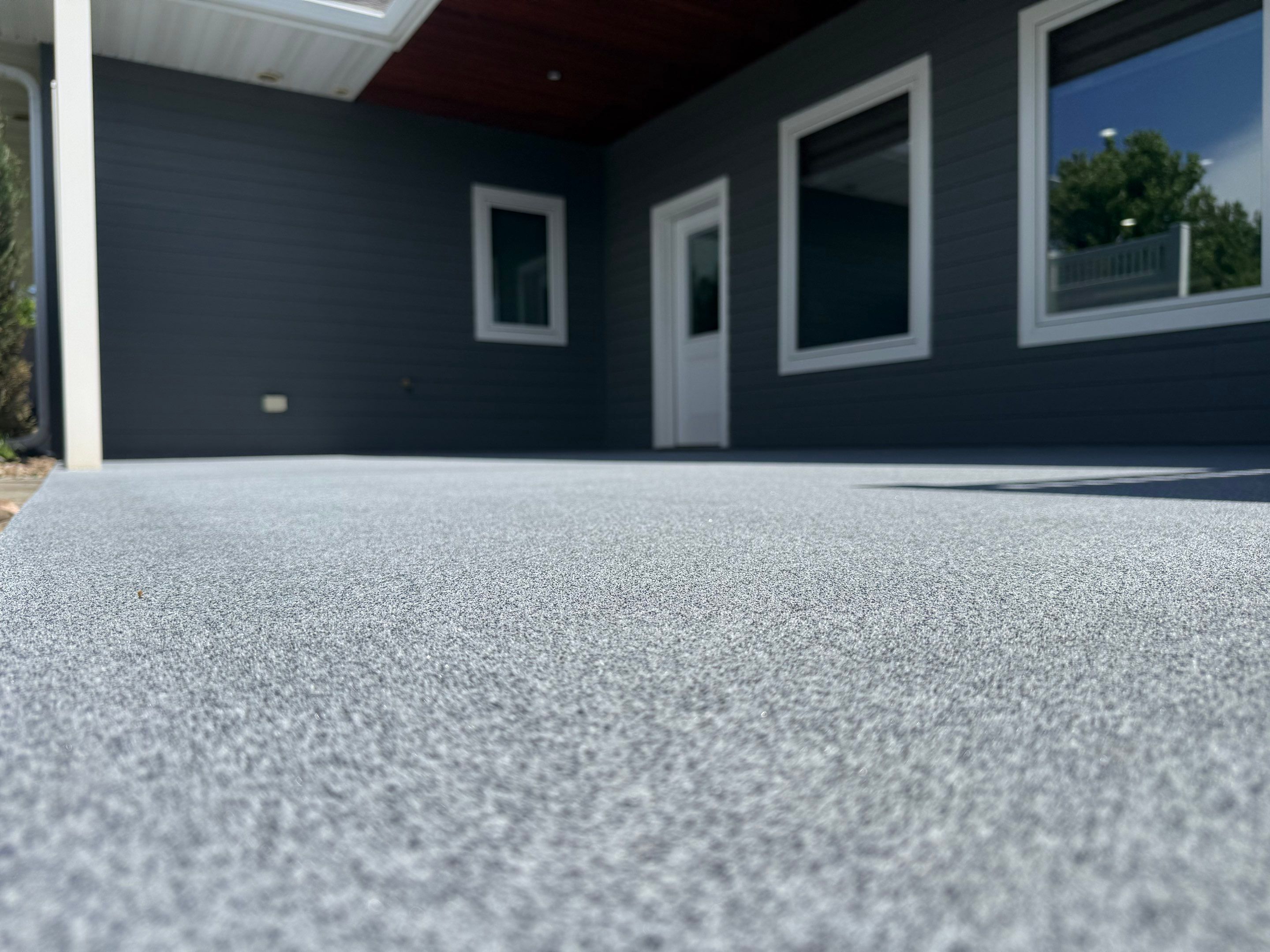 Polyurea Patio Floor Coating in Starry Evening for Sioux Falls Home by Select Painting, Coatings & Garage Cabinets