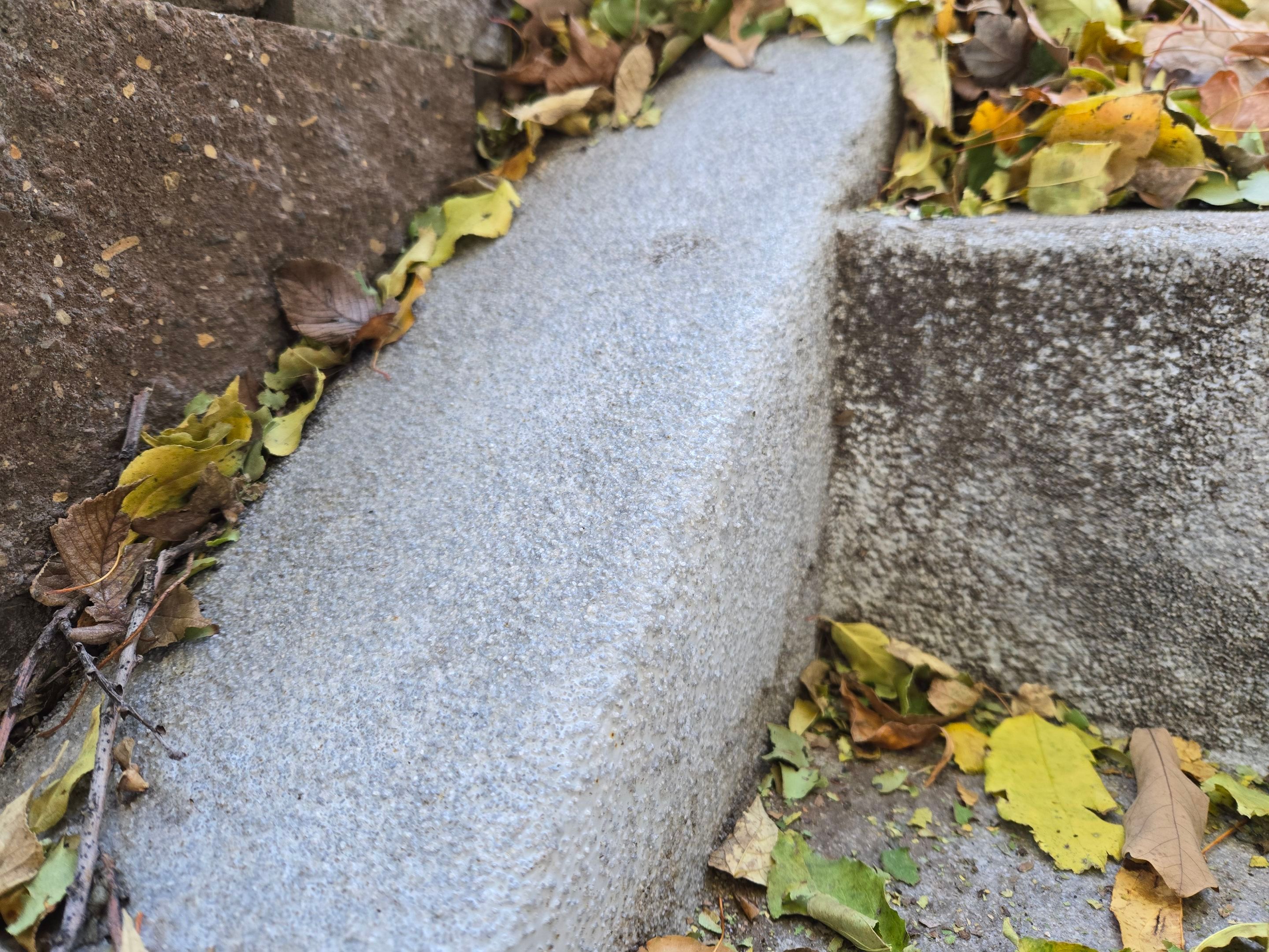 Grey Polyaspartic Porch and Stair Resurfacing in Sioux Falls by Select Painting, Coatings & Garage Cabinets