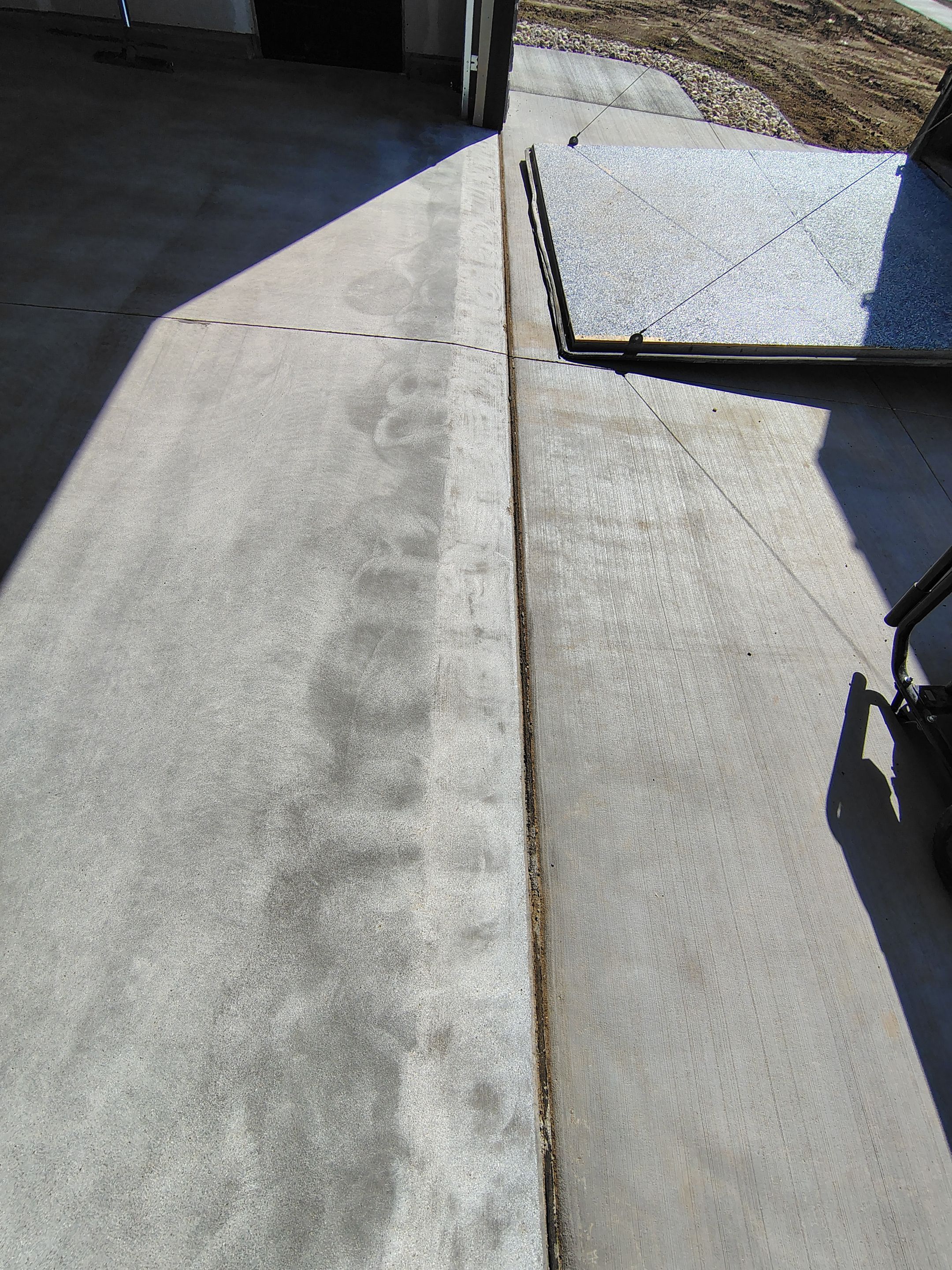 Speckled Epoxy Garage Floor Coating Installation in Sioux Falls by Select Painting, Coatings & Garage Cabinets