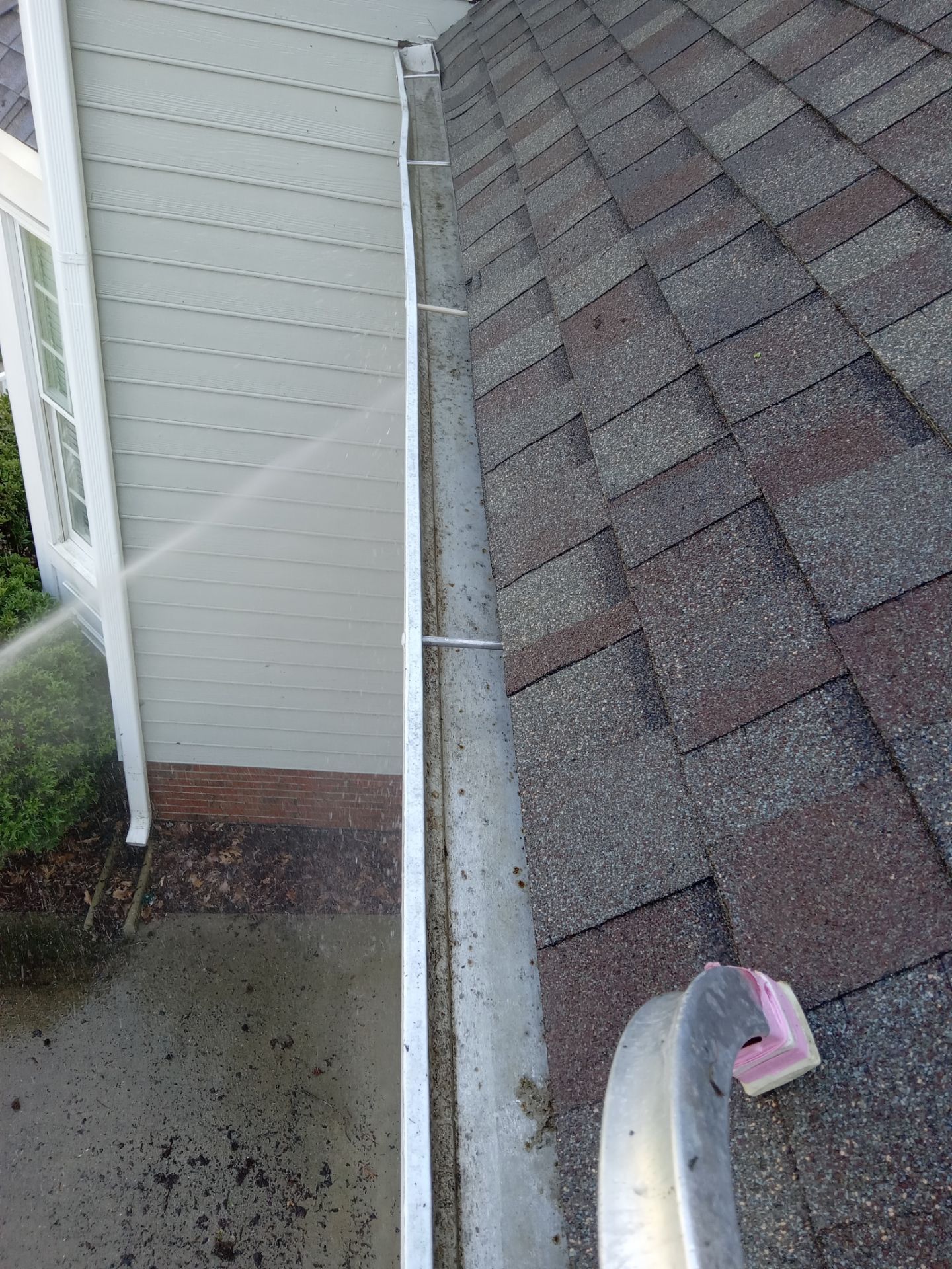 pressure washing gutter exterior cleaning dirt and debris removal roof and siding maintenance