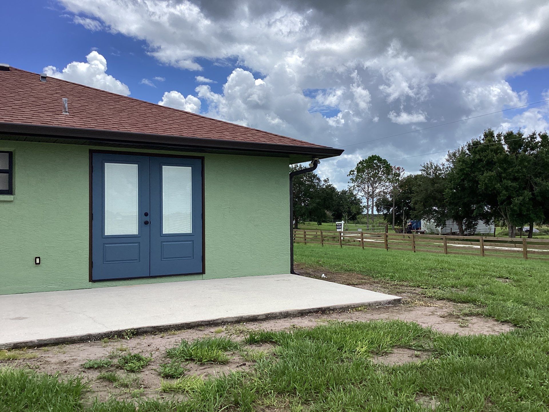 Musket brown downspouts with 6-inch K-Style gutter installation in Myakka City, FL by Gutter Professors