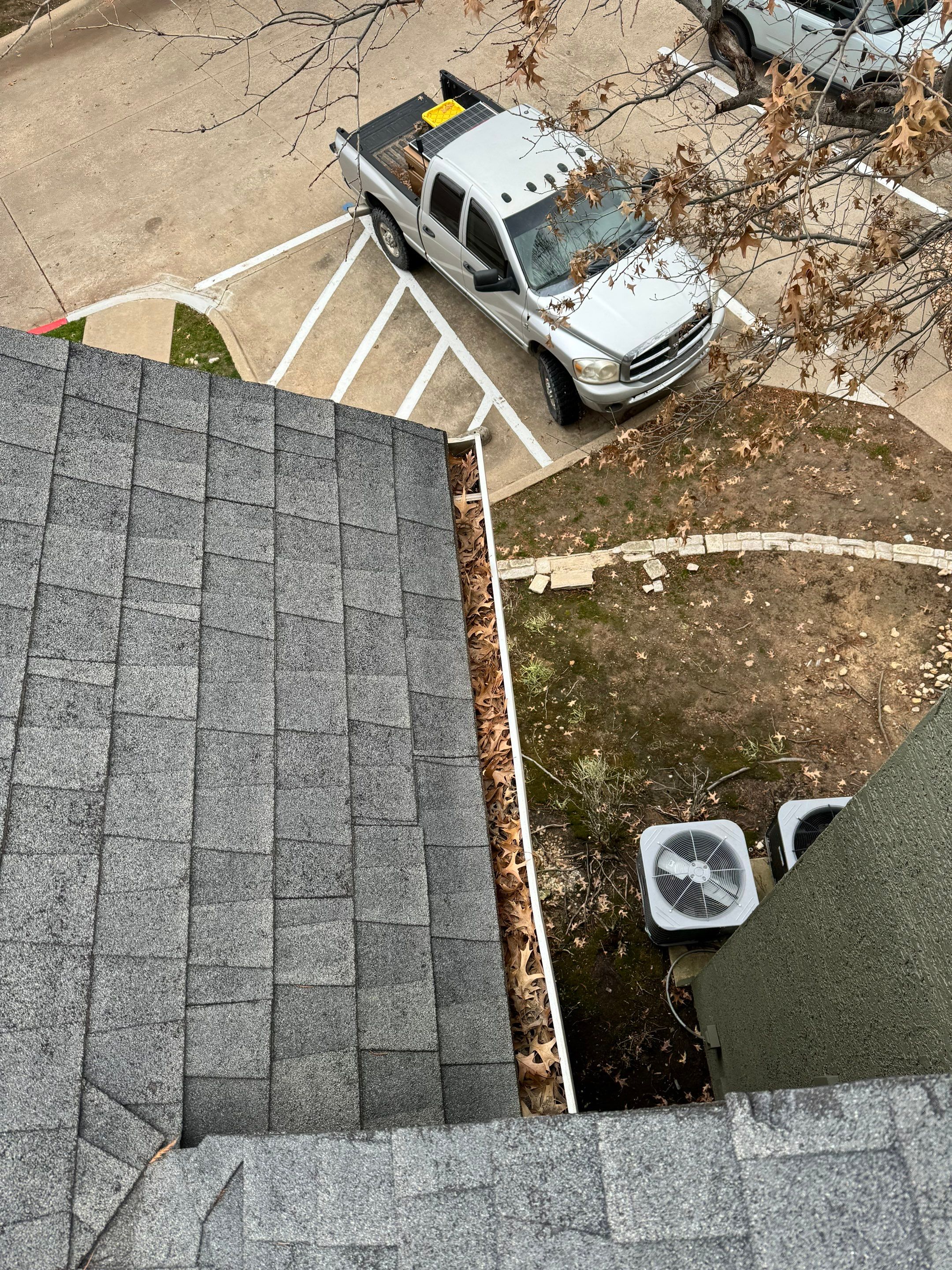 Commercial gutter cleaning Tulsa before photo with filled gutters