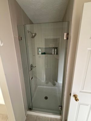 Custom Shower Renovation With Vertical Tile and Frameless Glass in Kennesaw