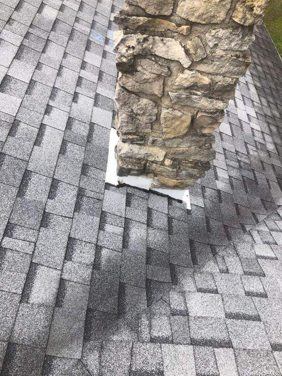 Storm damage roof replacement by Nitro Roofing and Construction