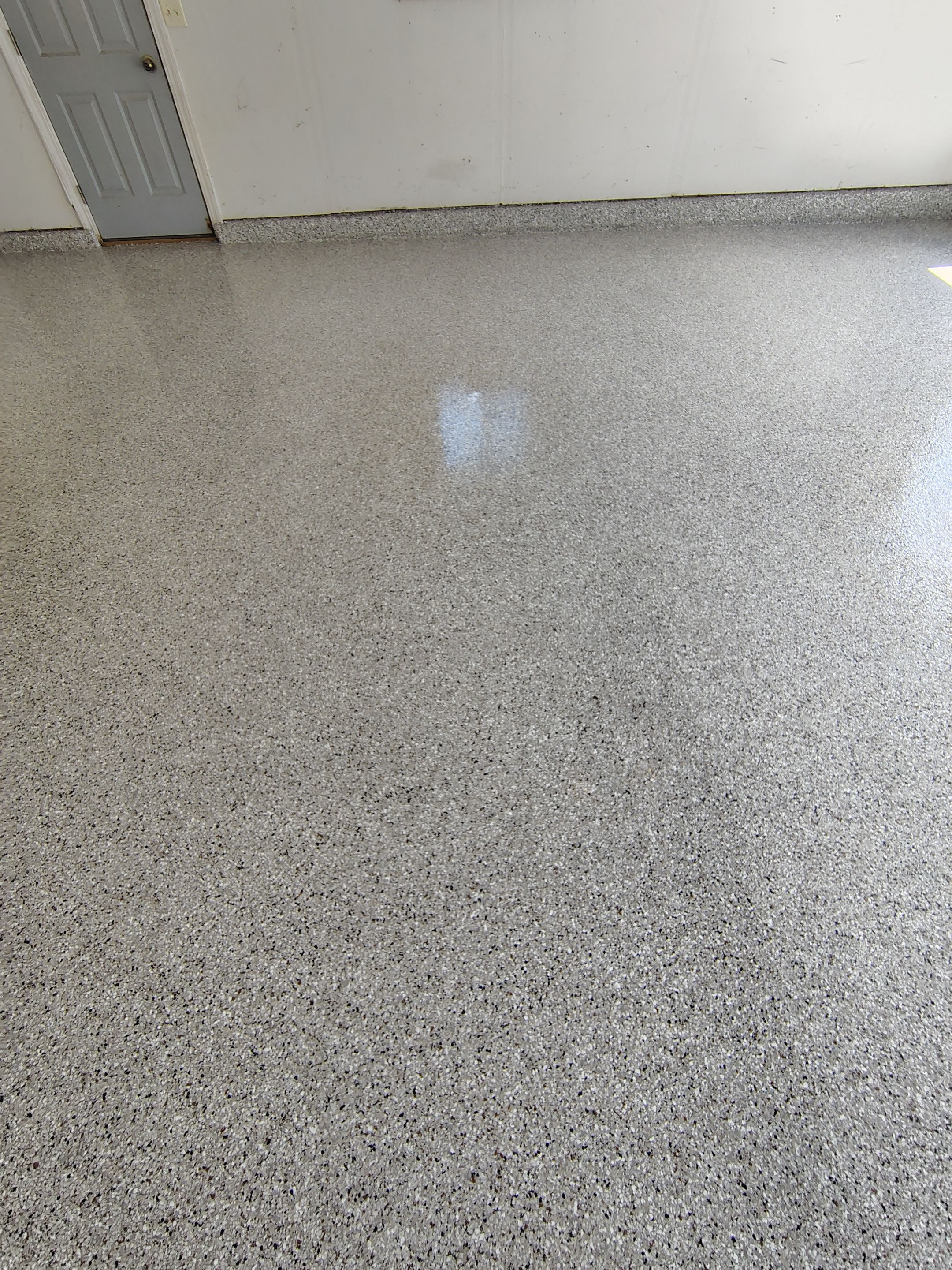 Decorative Chip Epoxy Garage Floor Coating in Sioux Falls by Select Painting, Coatings & Garage Cabinets