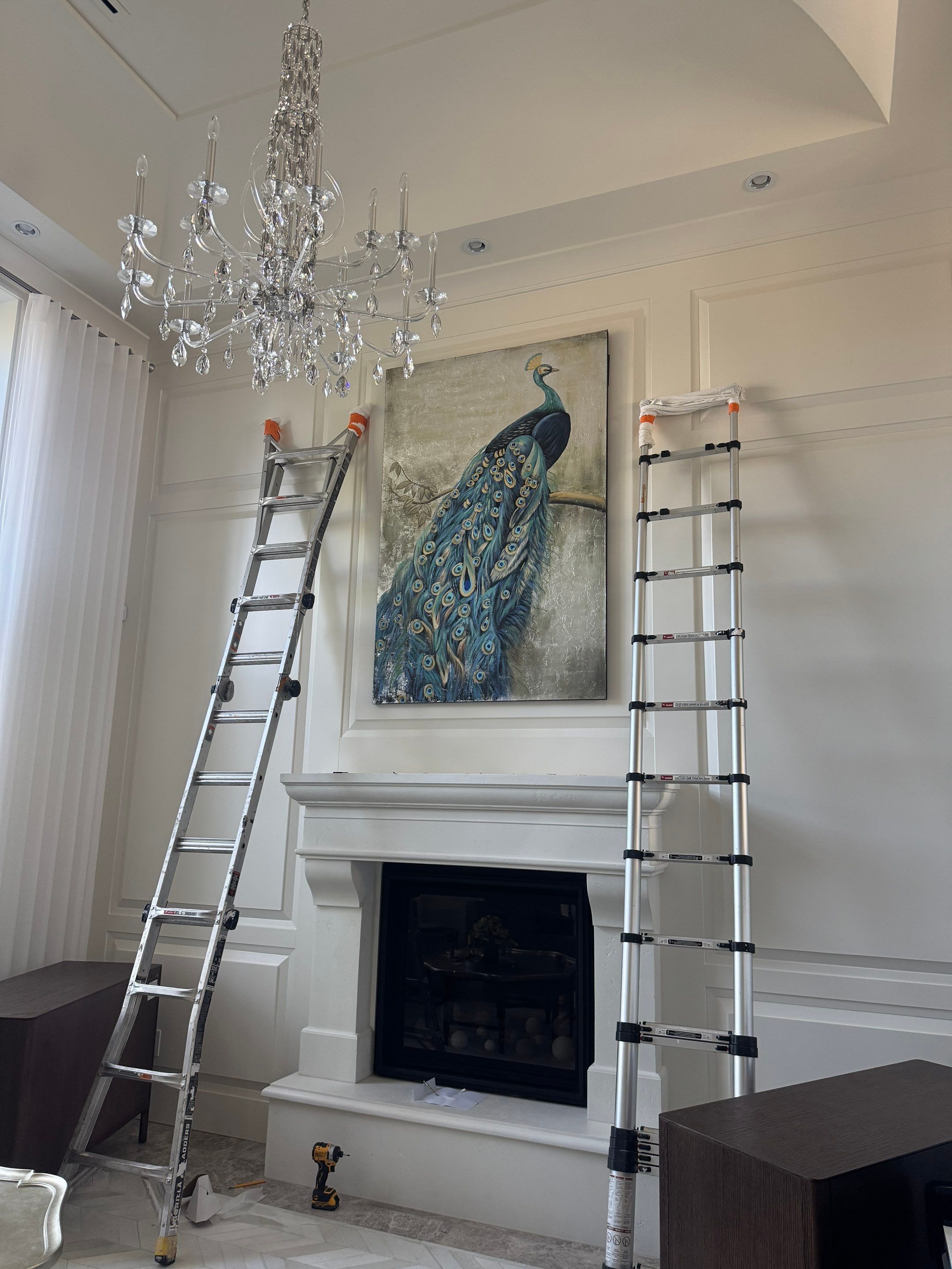 Professional Hanging of Mirrors & Art in a Designer Home by YVR Construction Group