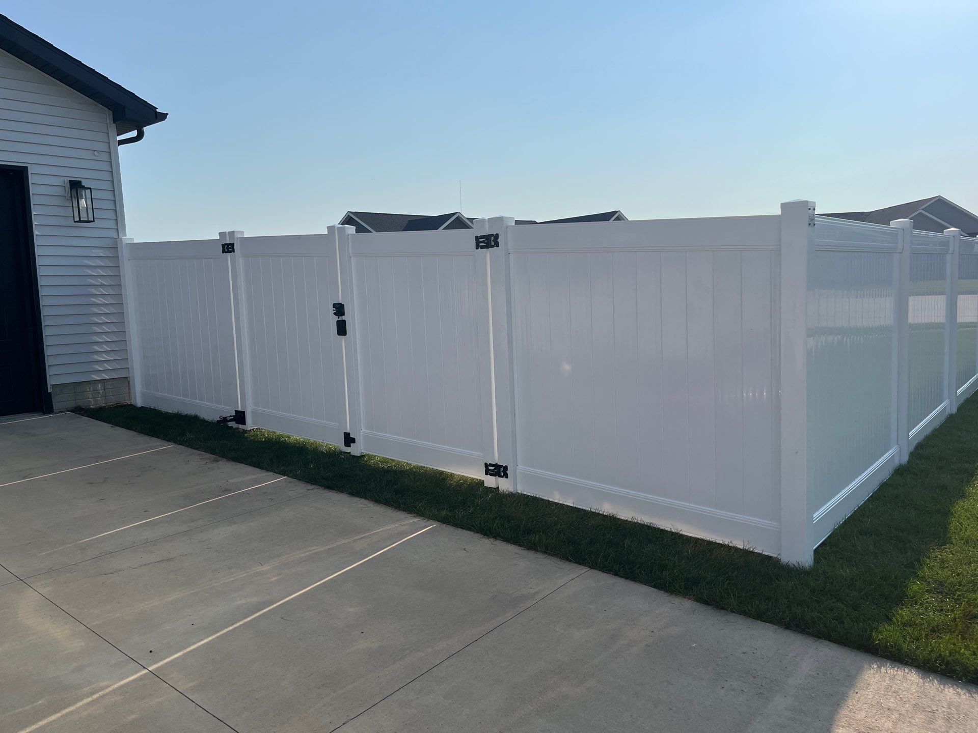 White Vinyl Privacy Fence Installation With Double Gates in Waterloo by Perfect Picket Fence and Stain