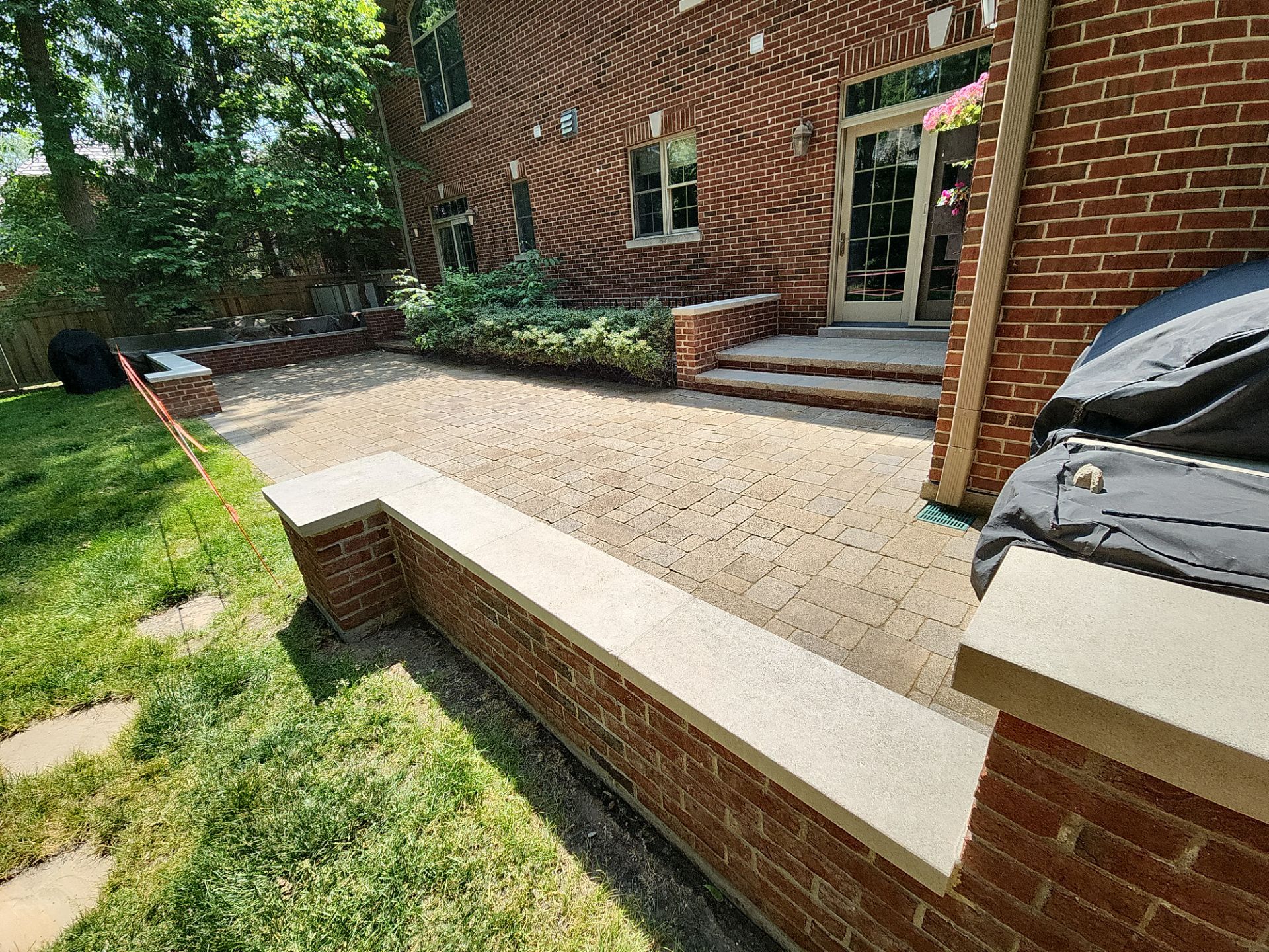 Brick paver repair, clean, seal and poly sanding by Northern Power Washing LLC.