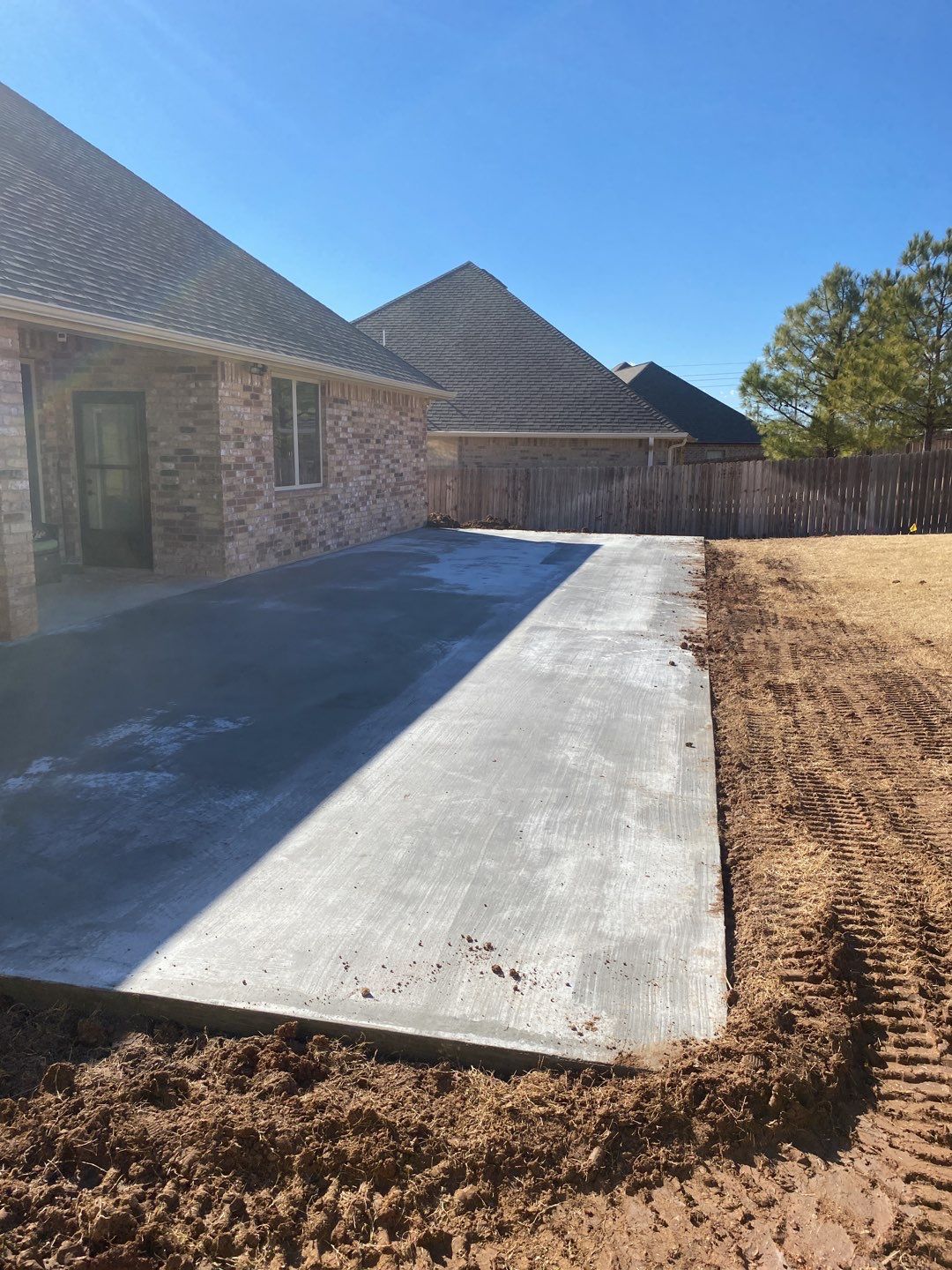Concrete Slab , Retaining Wall , Fence, and landscape. by Clays Services Inc