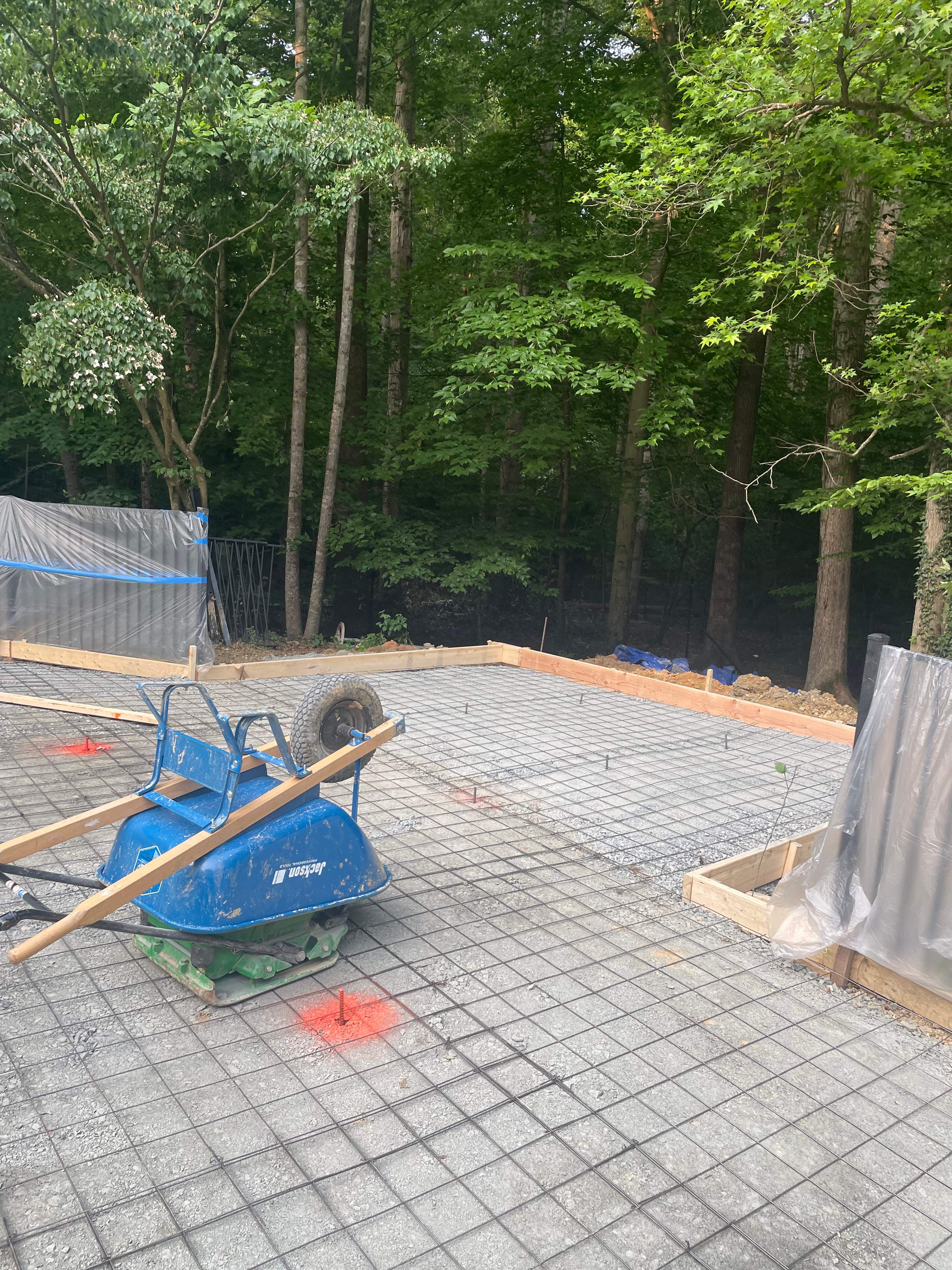 Pool Surround remodel with retaining walls, new waterfall and water slide by Fairfax Contractors, LLC