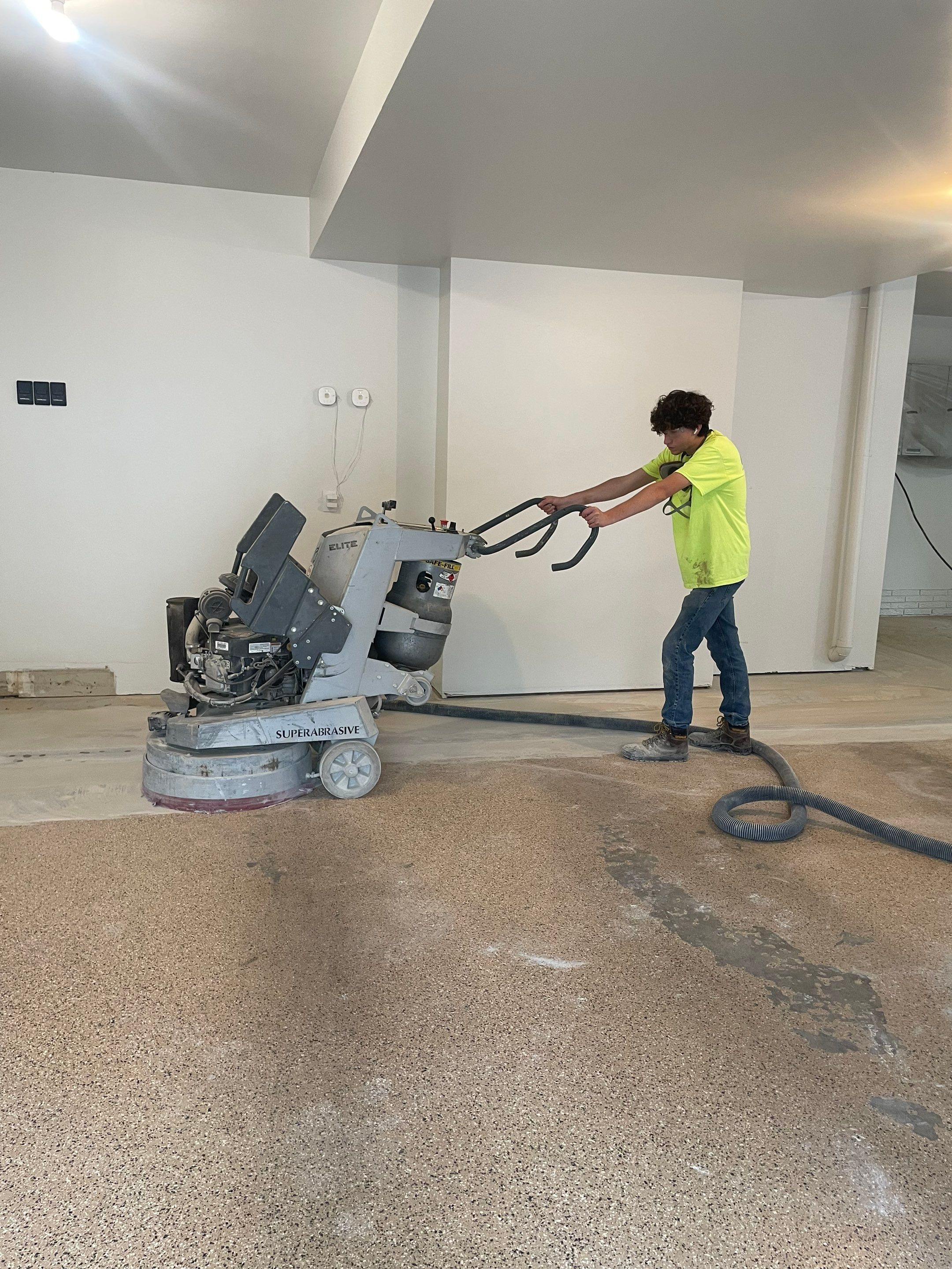 Gray Speckled Epoxy Garage Floor Coating in Sioux Falls by Select Painting, Coatings & Garage Cabinets